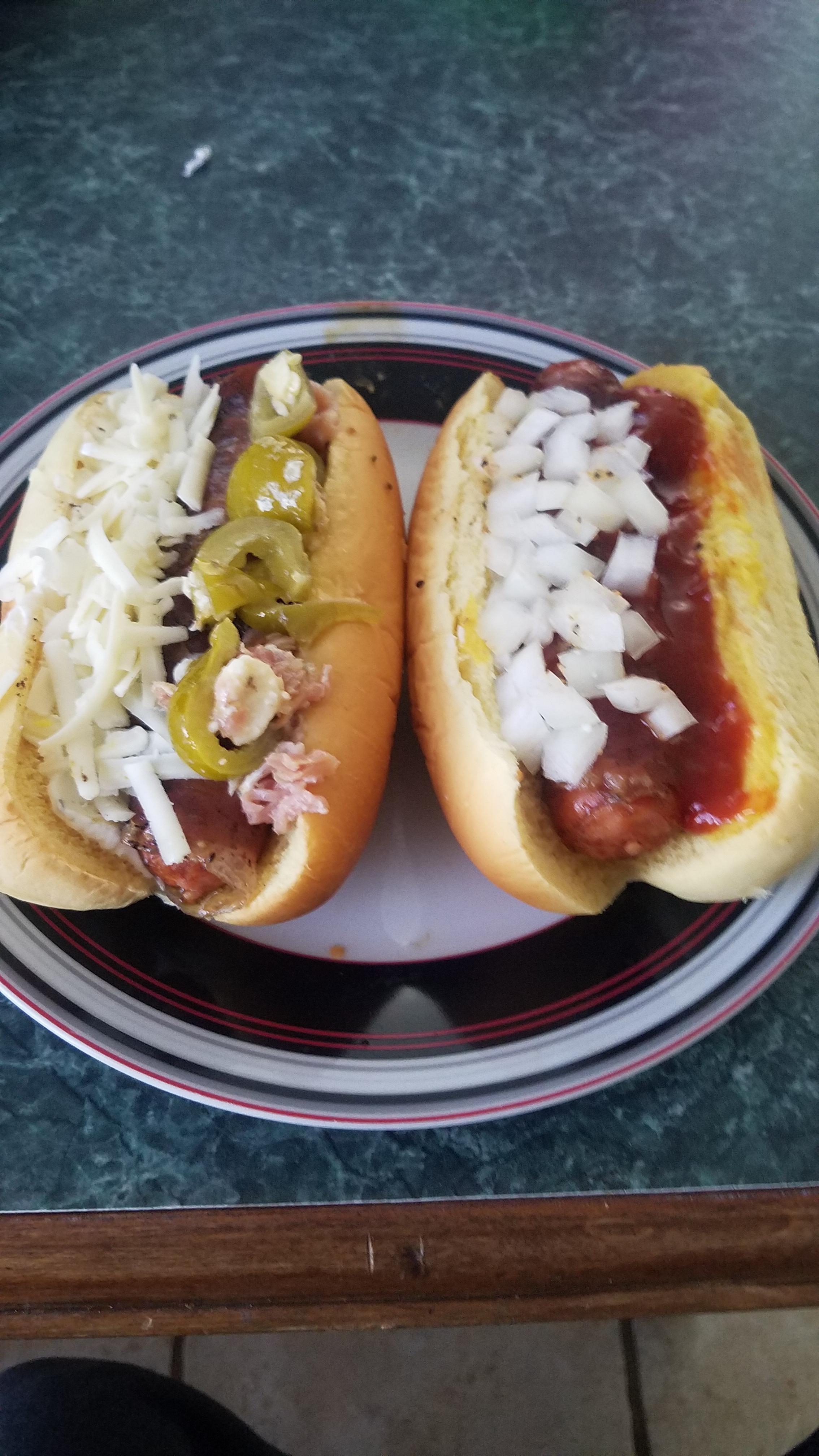 Prosciutto wrapped cheddar dogs, the left with a homemade aioli with more cheese and a diced