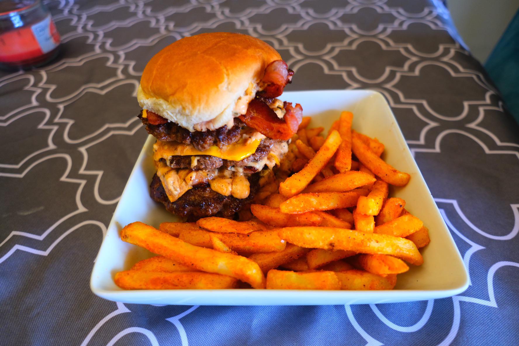Quadruple bacon cheese burger with homemade animal sauce and fries. It isn’t pretty, but damn is