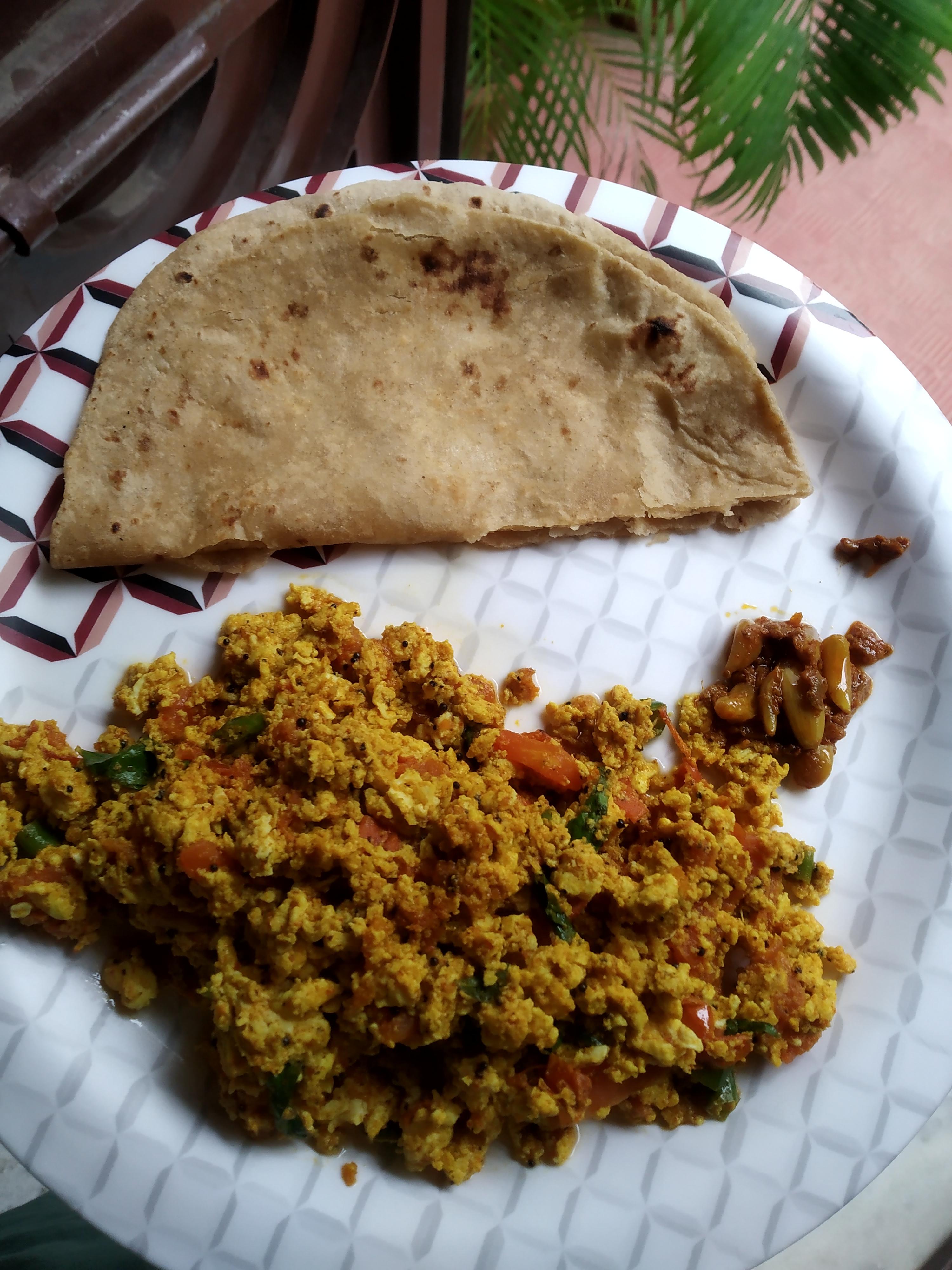 Scrambled eggs in Indian spices + diced tomatoes and onions. With a