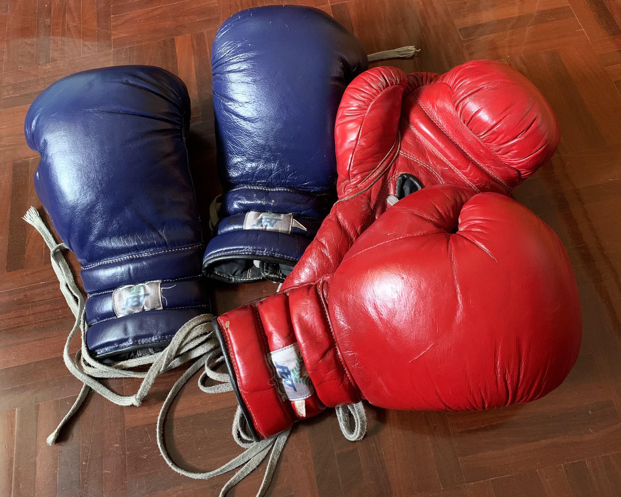 some old boxing gloves with sweat on it. Scrolller