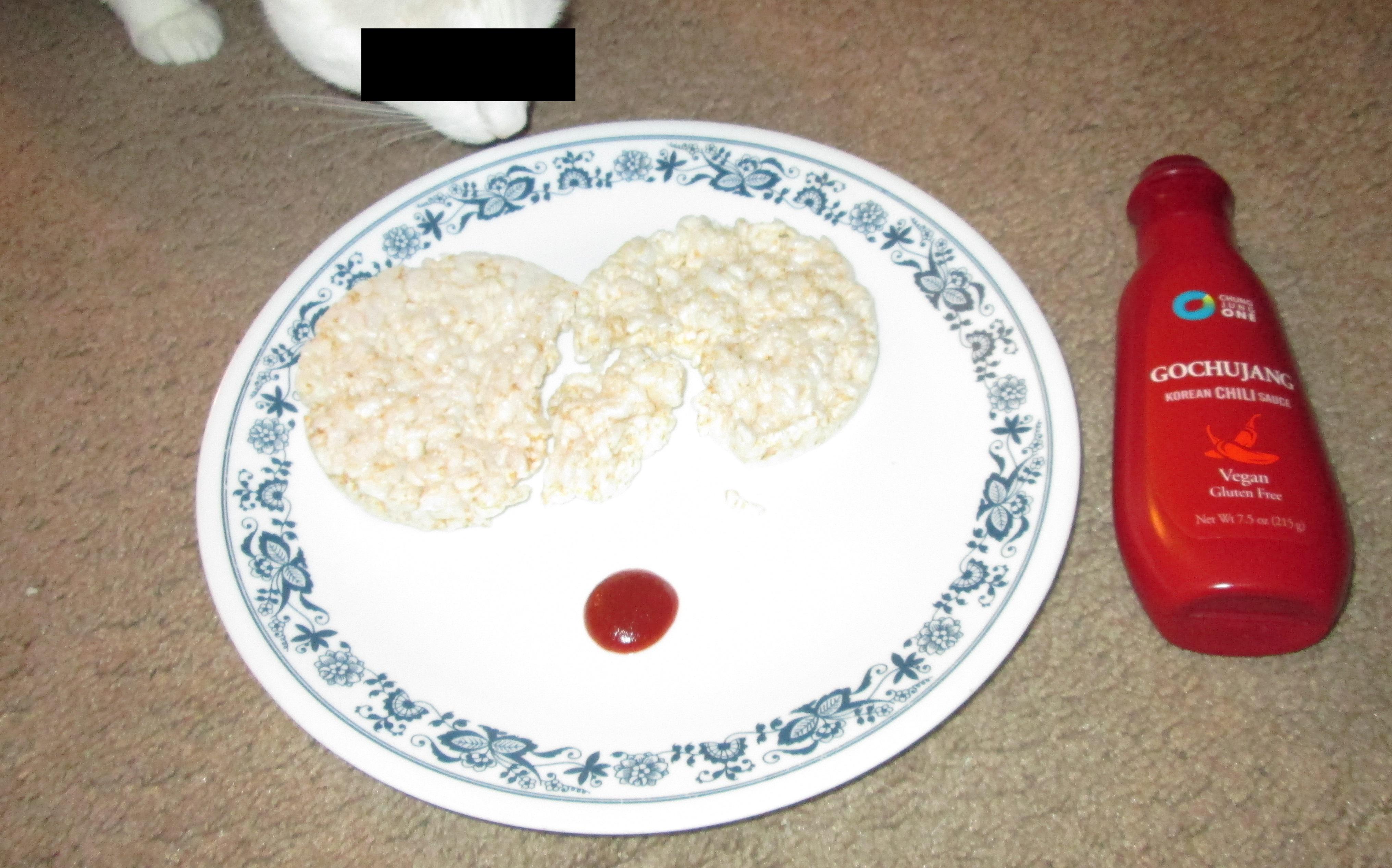 Stale rice cakes dipped in gochujang chili sauce, eaten on the dirty