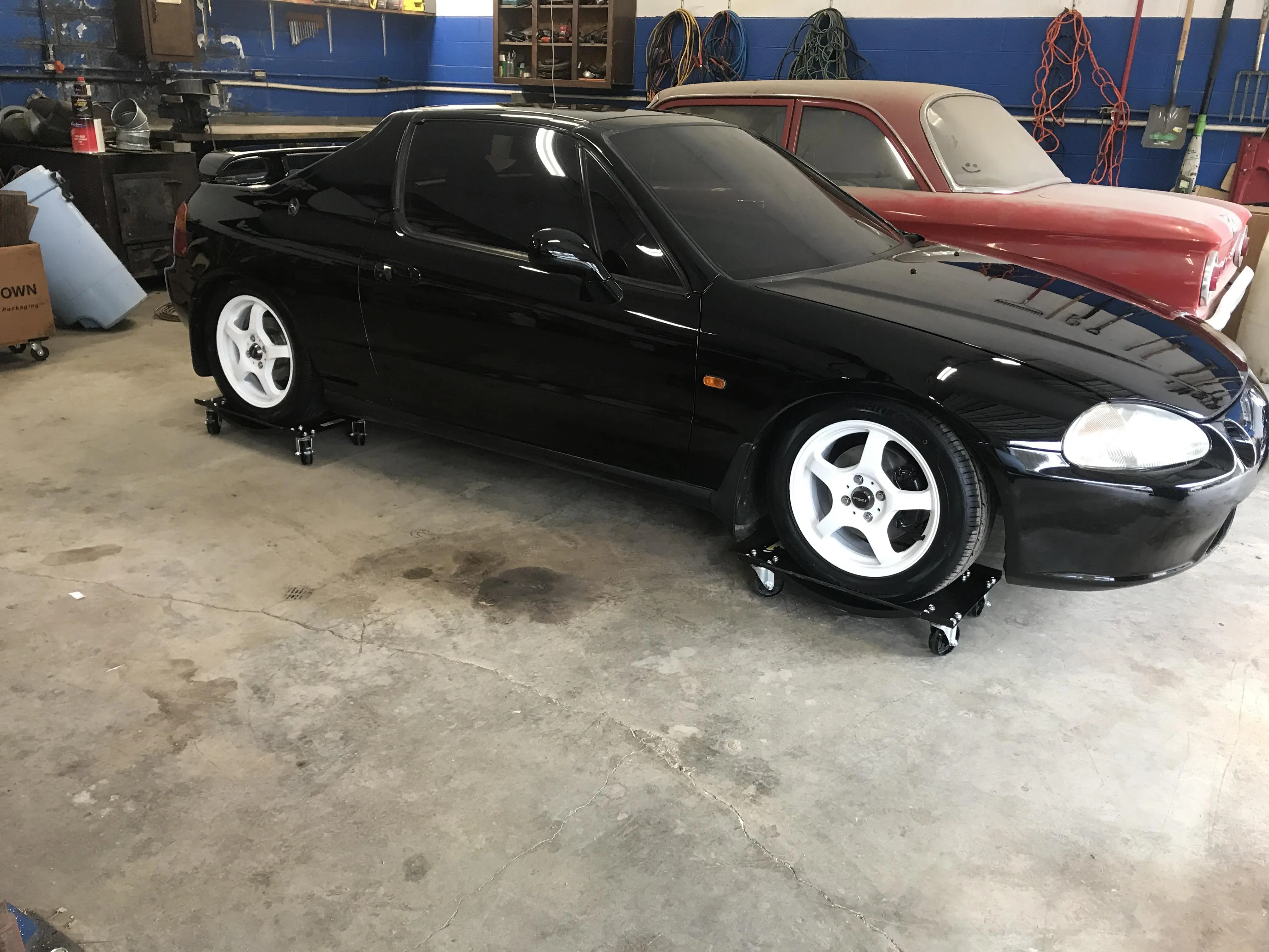 The RHD stored for winter. Powder coated the wheels and new brakes and ...