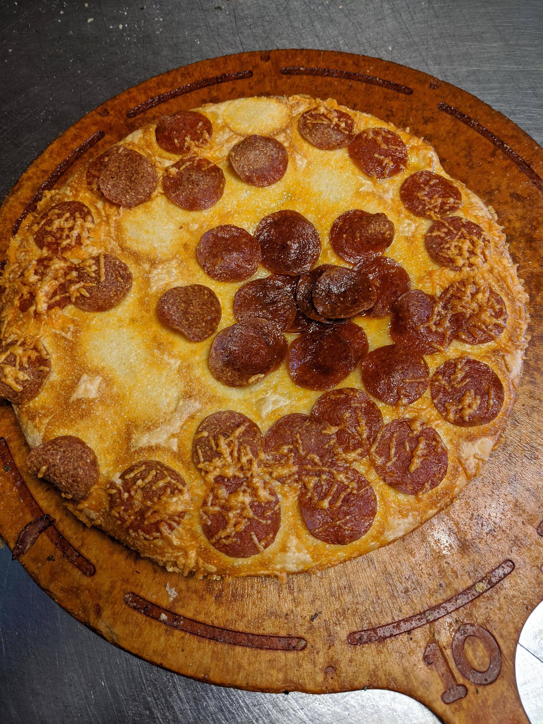 This sad, sauceless, cheeseless, pepperoni pan pizza. Scrolller