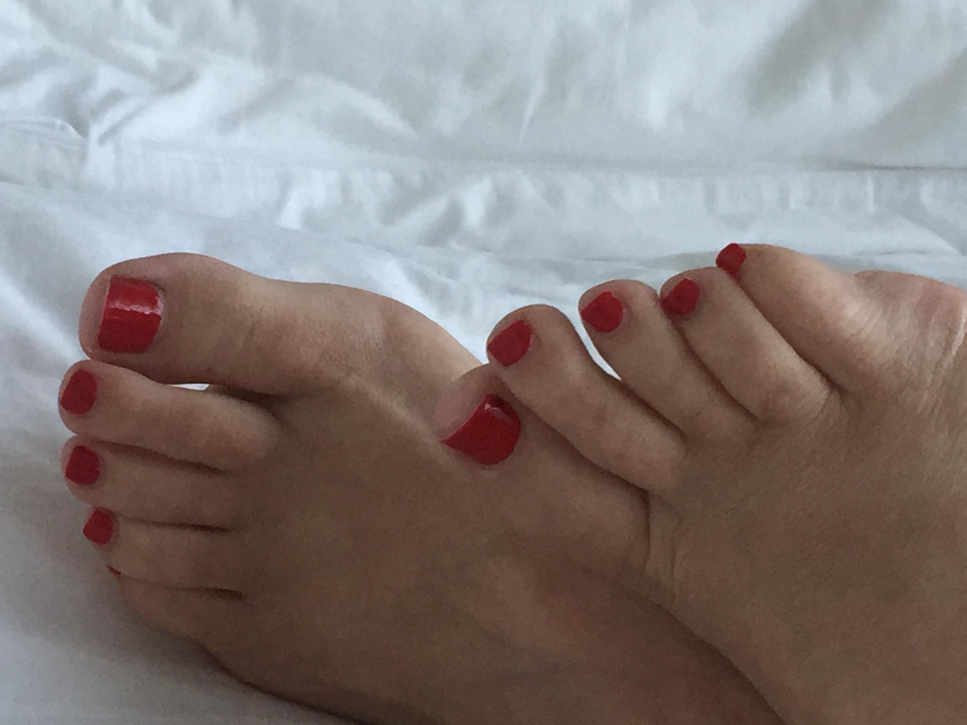 Verify me Stretching my feet out over white sheets Scrolller