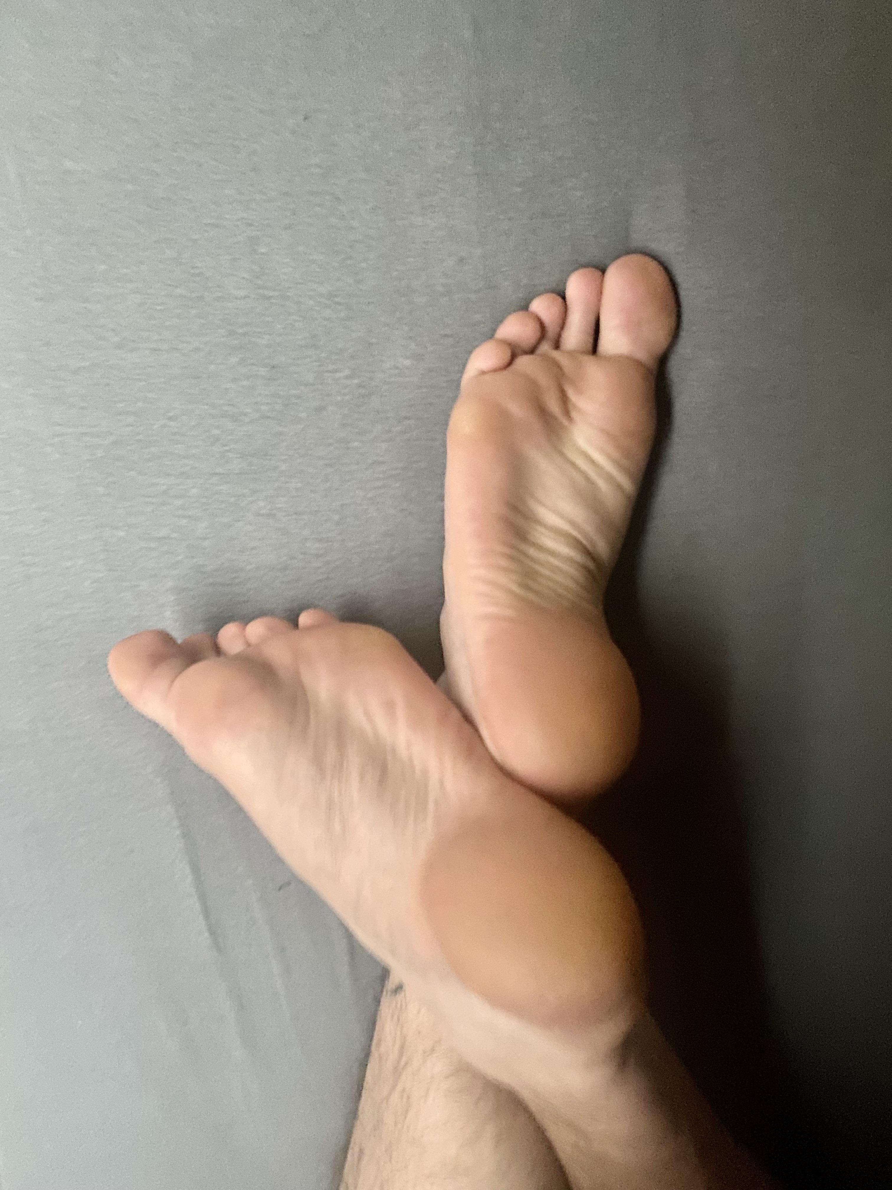 Male feet licked