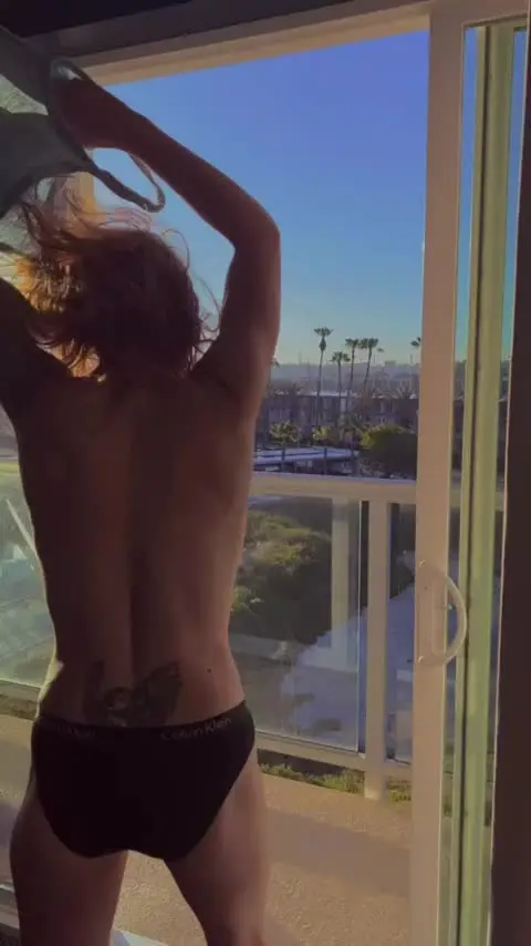Staying in a hotel means you flash on the balcony in the morning. It’s the rules. [GIF]