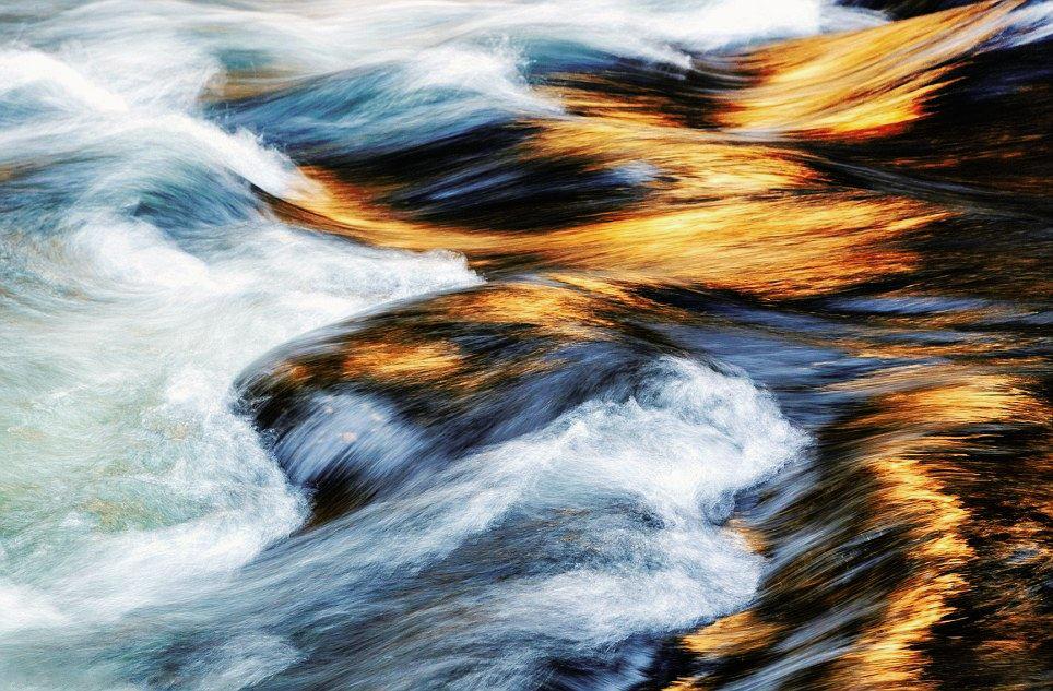 Sun reflecting on a fast-moving river. [964x633] | Scrolller