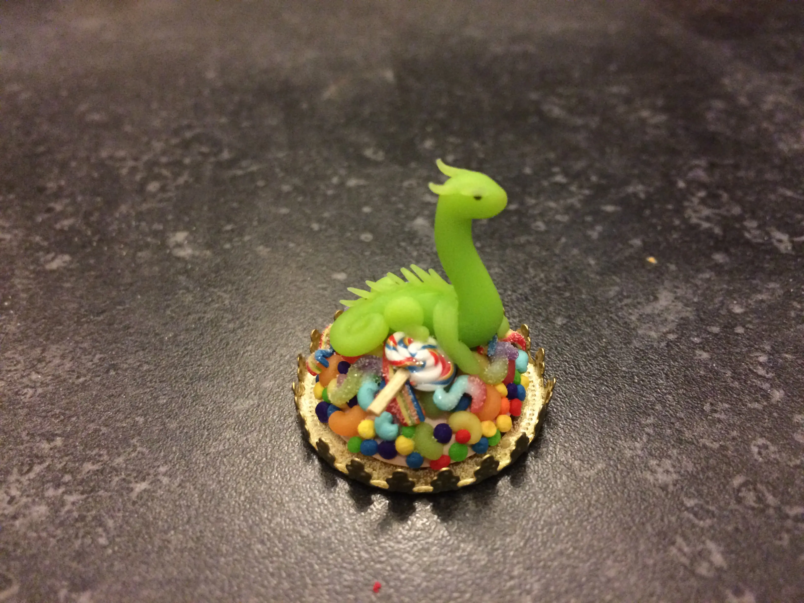 Baby dragon guarding his candy hoard! | Scrolller