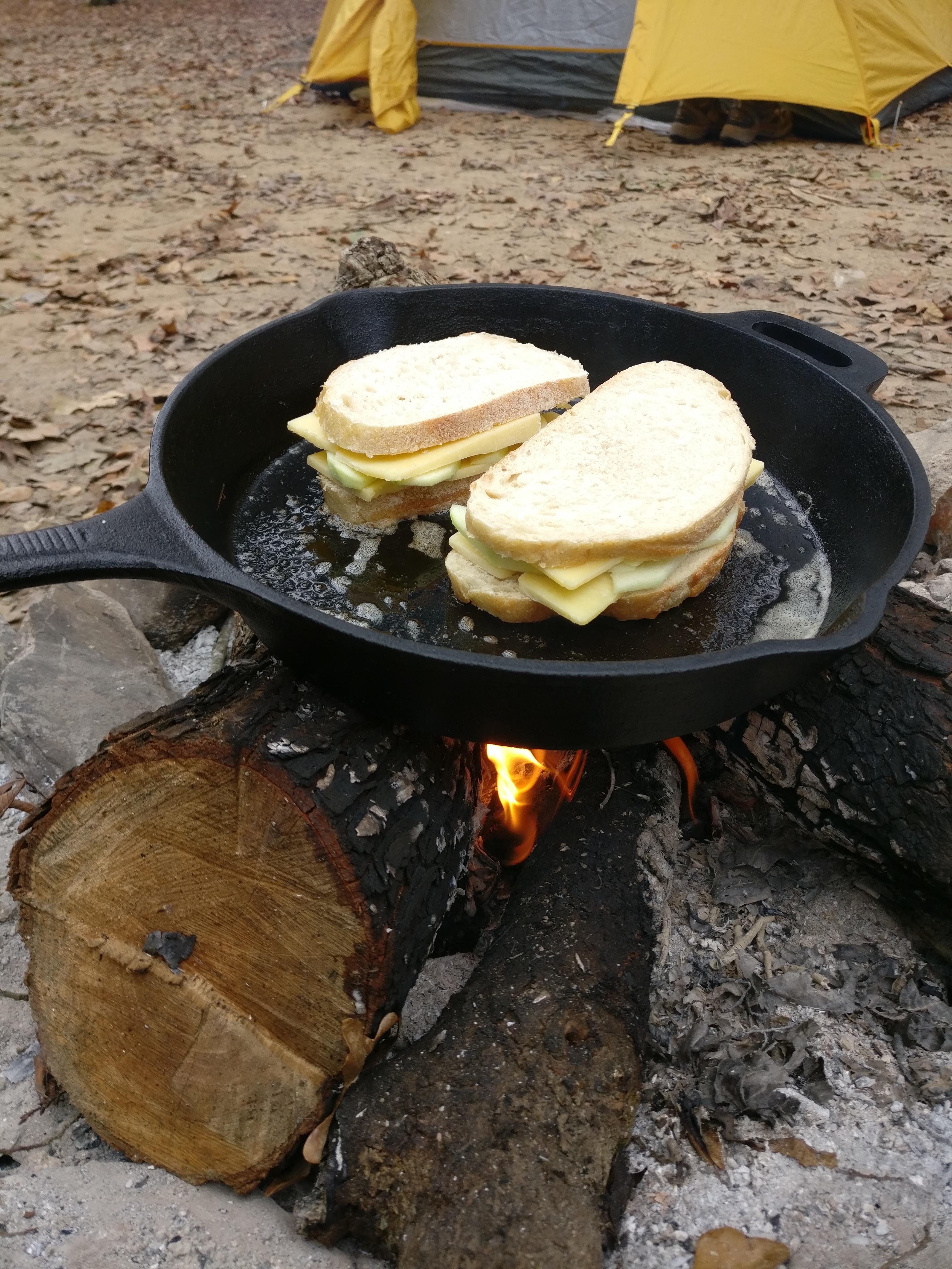 Granny Smith apple and aged cheddar melt over a campfire. Scrolller