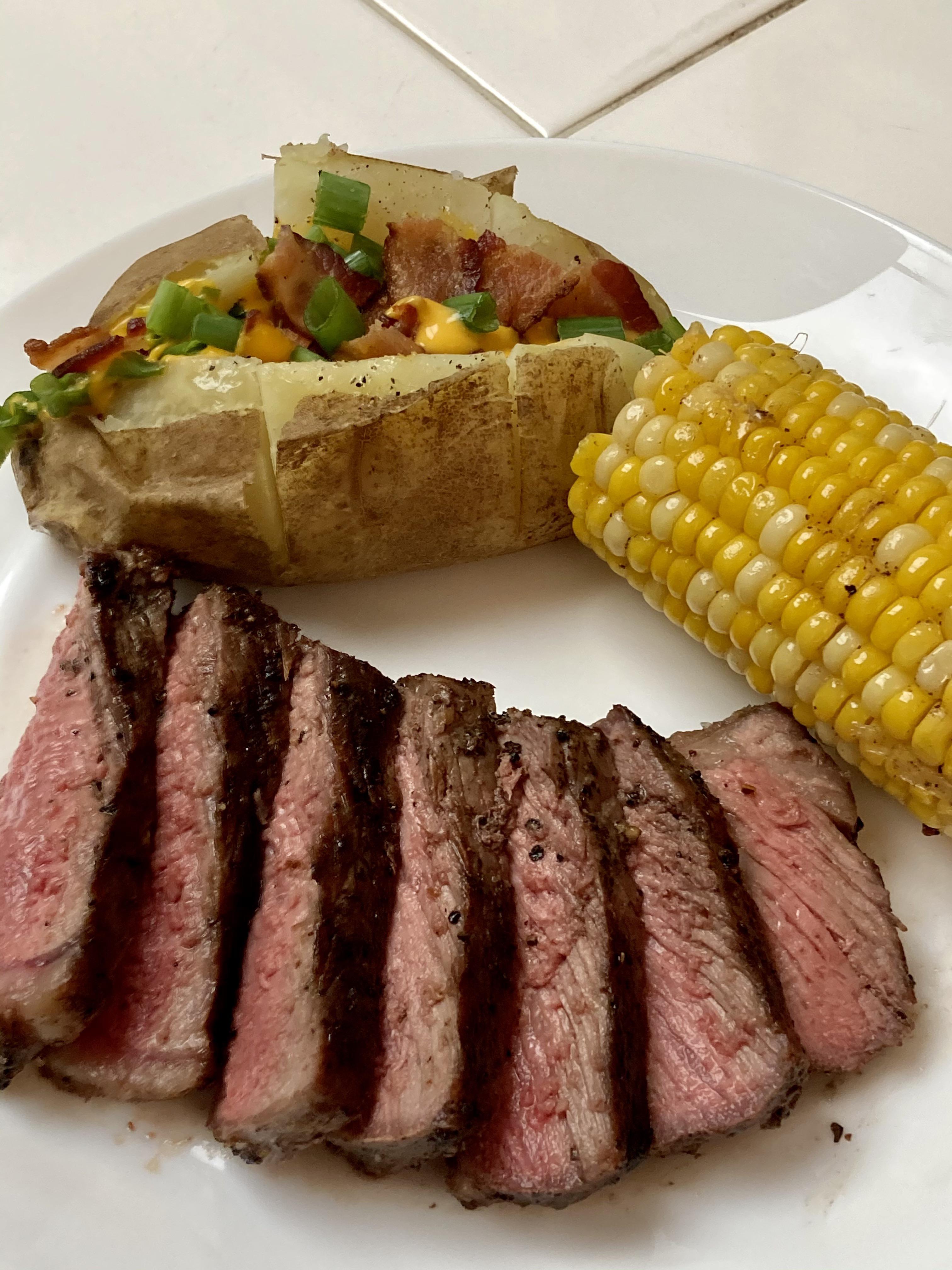 [Homemade] NY Strip steak, loaded baked potato and corn on the cob