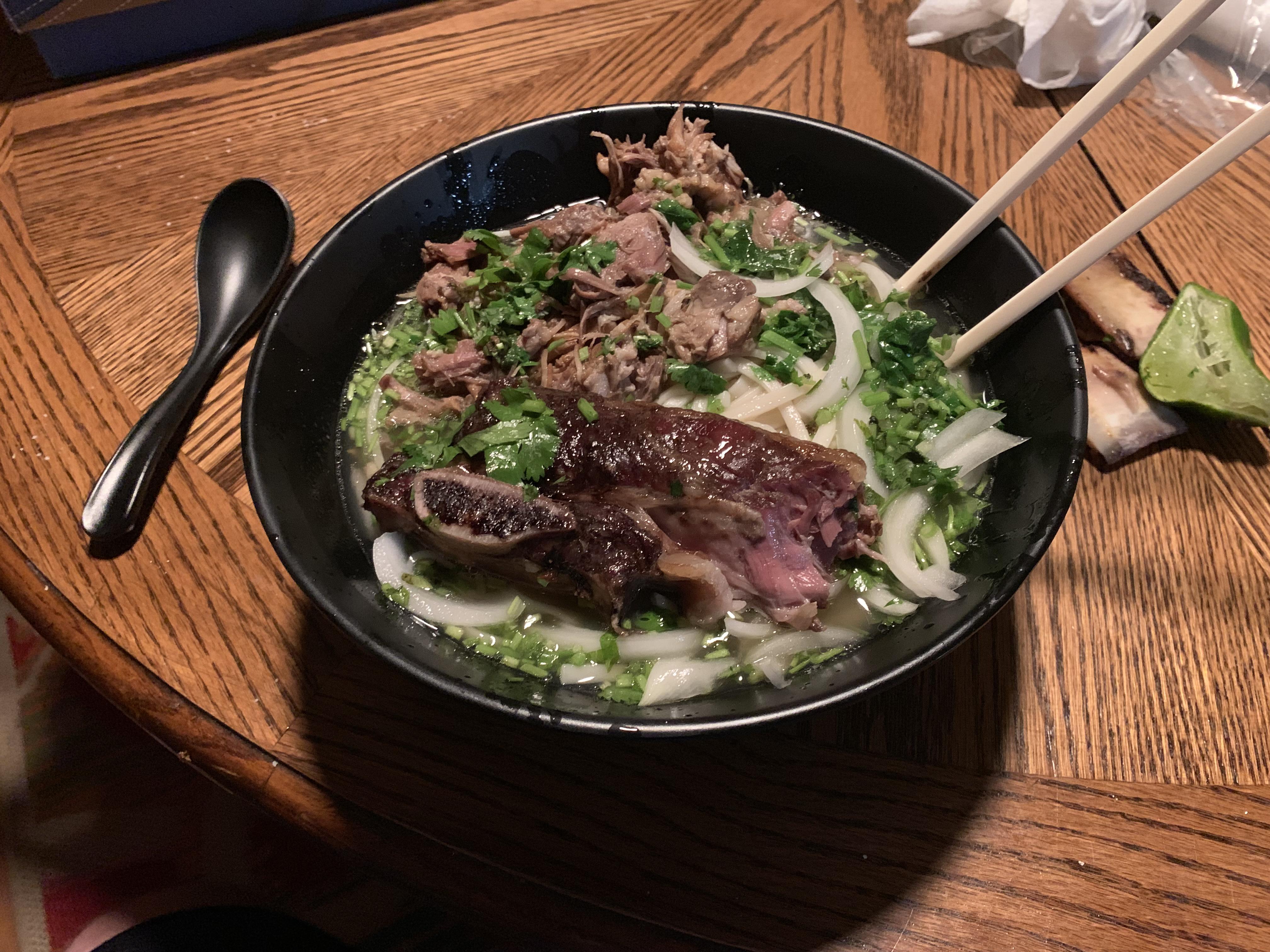 Homemade oxtail, beef shank, and pork neck bone Pho broth with udon