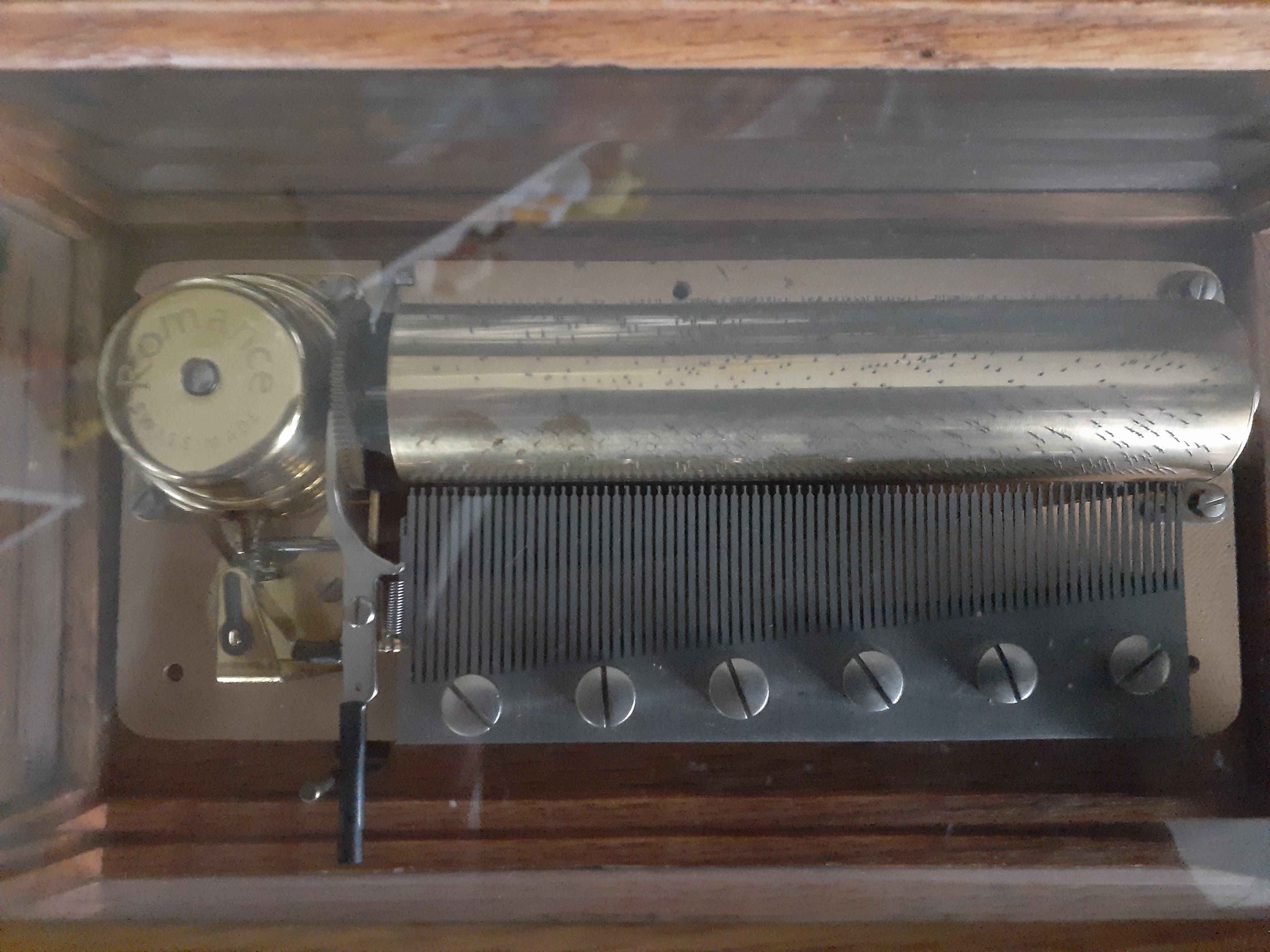 How much is a Romance Swiss made 72 note music box worth ? Scrolller