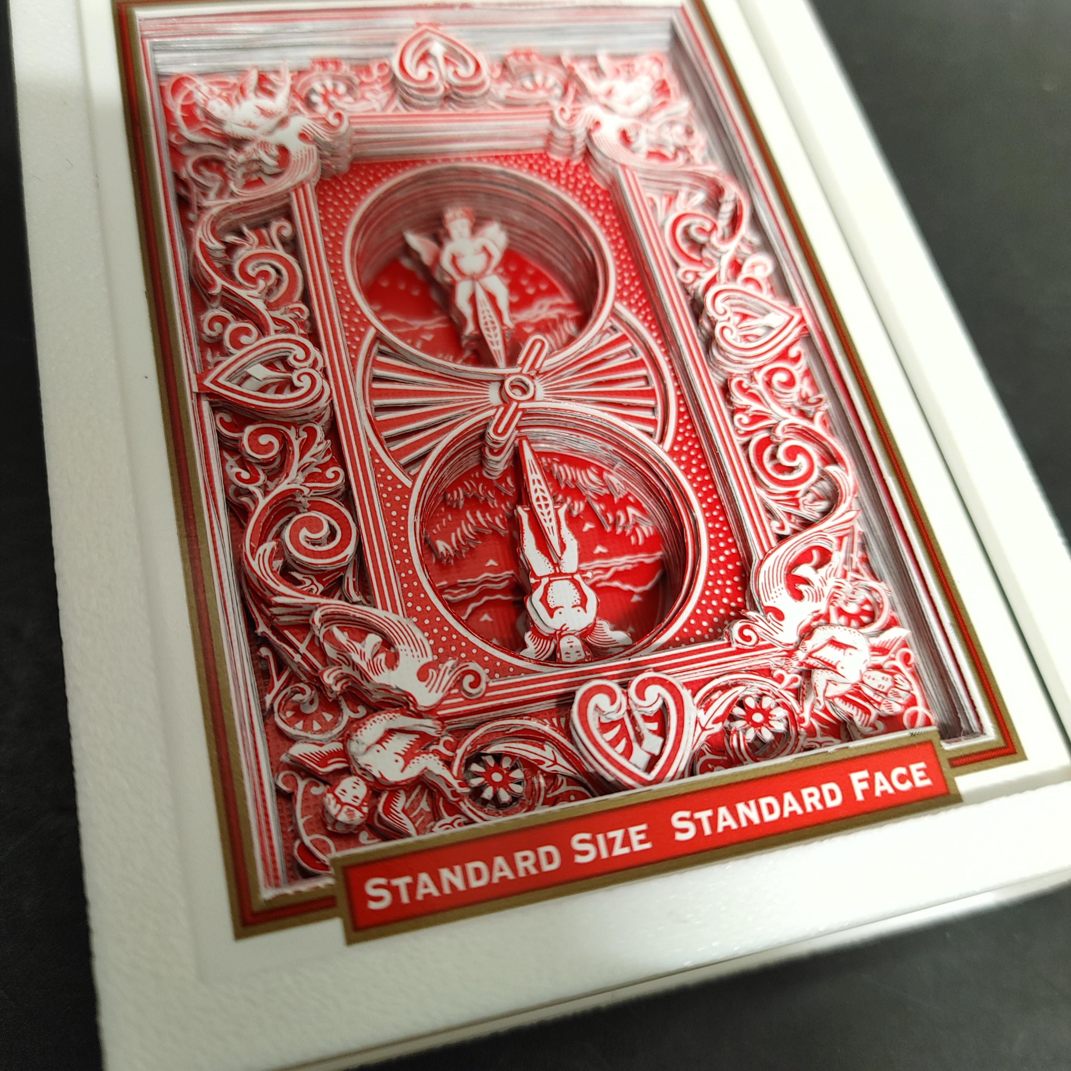 I cut playing cards into 3D art using an xacto. I managed to cutout the