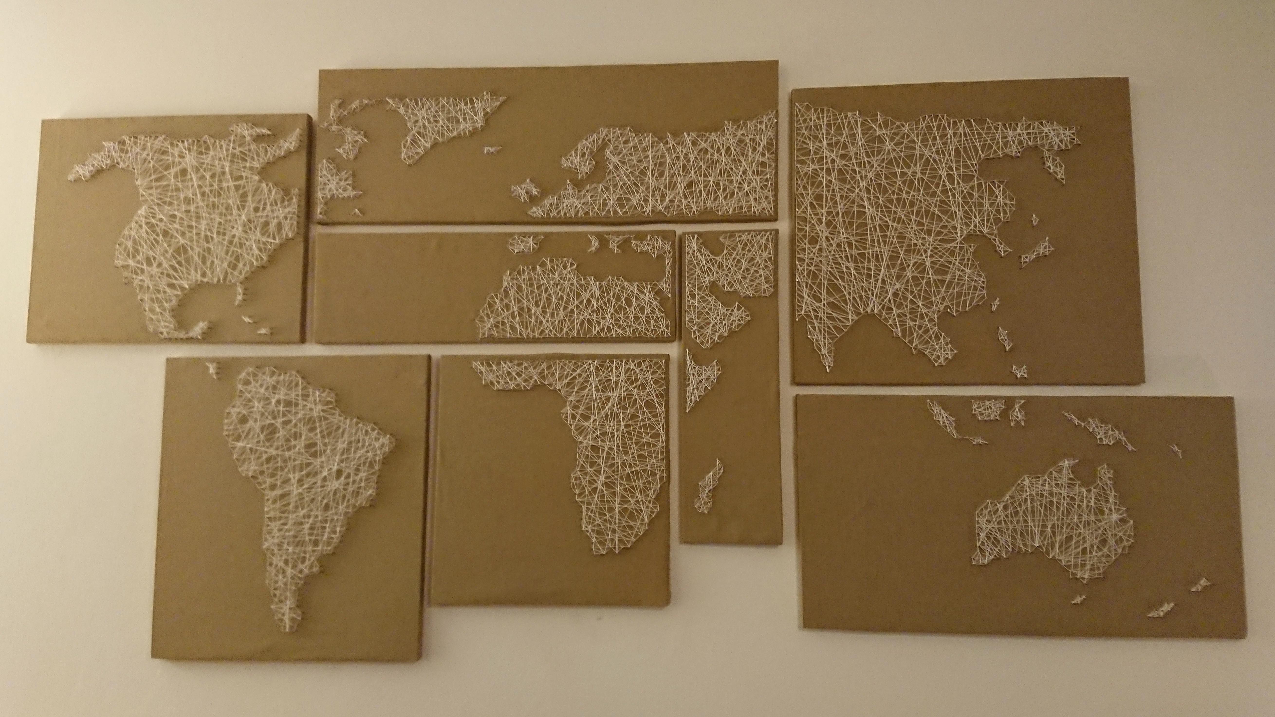 I finally finished the string art world map for our living room wall ...