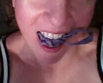 Slim brunette white girl in a light blue top and purple panties posing for a gonewild selfie in a bedroom