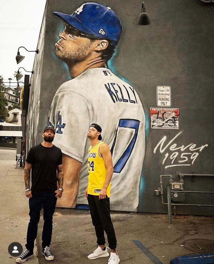 Joe Kelly in front of his mural | Scrolller