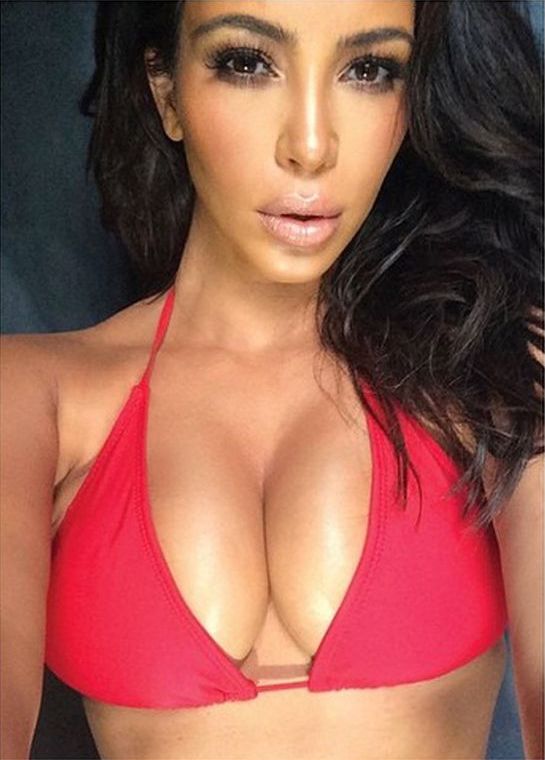 Kim Kardashian flaunts boobs Scrolller
