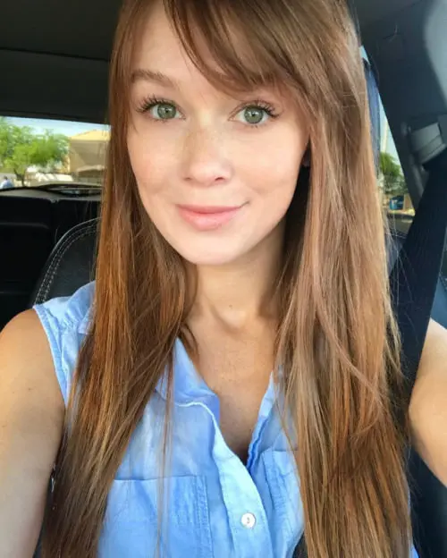 Leanna Decker, a busty redhead in lingerie, swimwear, and nude poses.