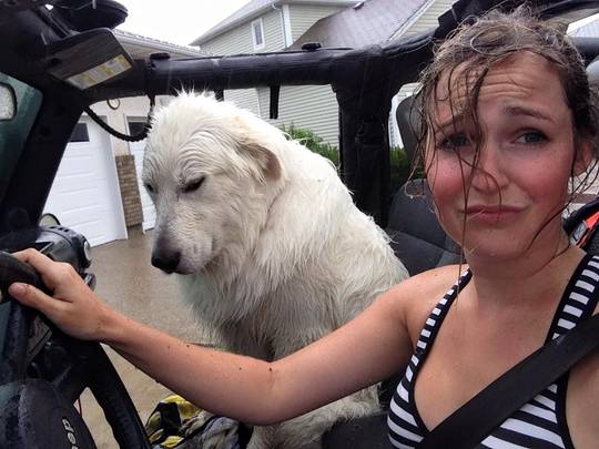 Girl and puppy are sad and wet