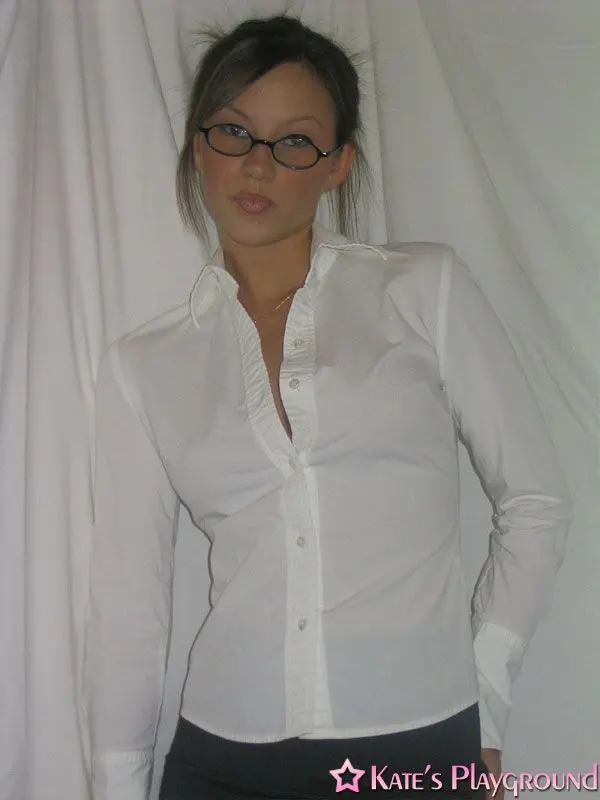 Kate in a sexy teacher outfit featuring a white blouse, tight grey pencil skirt, and glasses