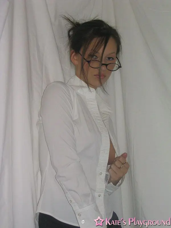 Kate in a sexy teacher outfit featuring a white blouse, tight grey pencil skirt, and glasses
