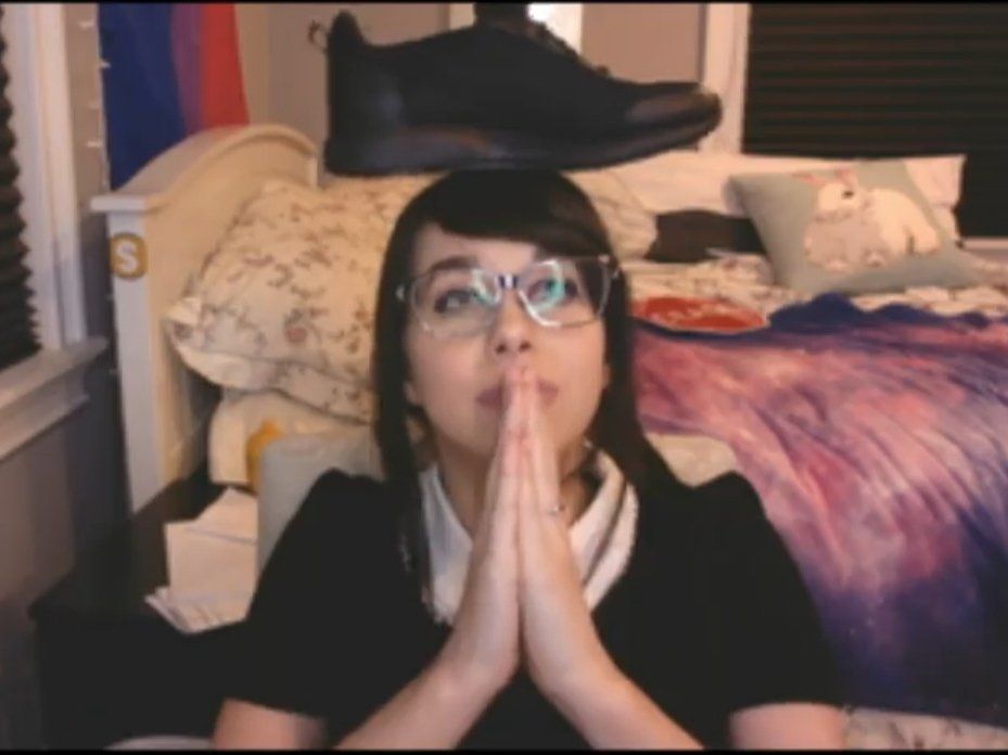 Shoe0nHead with a shoe on her head Scrolller