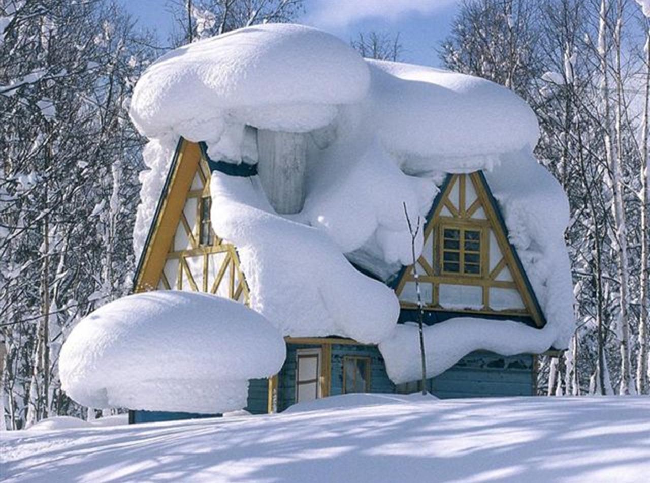 Snow covered cottage.