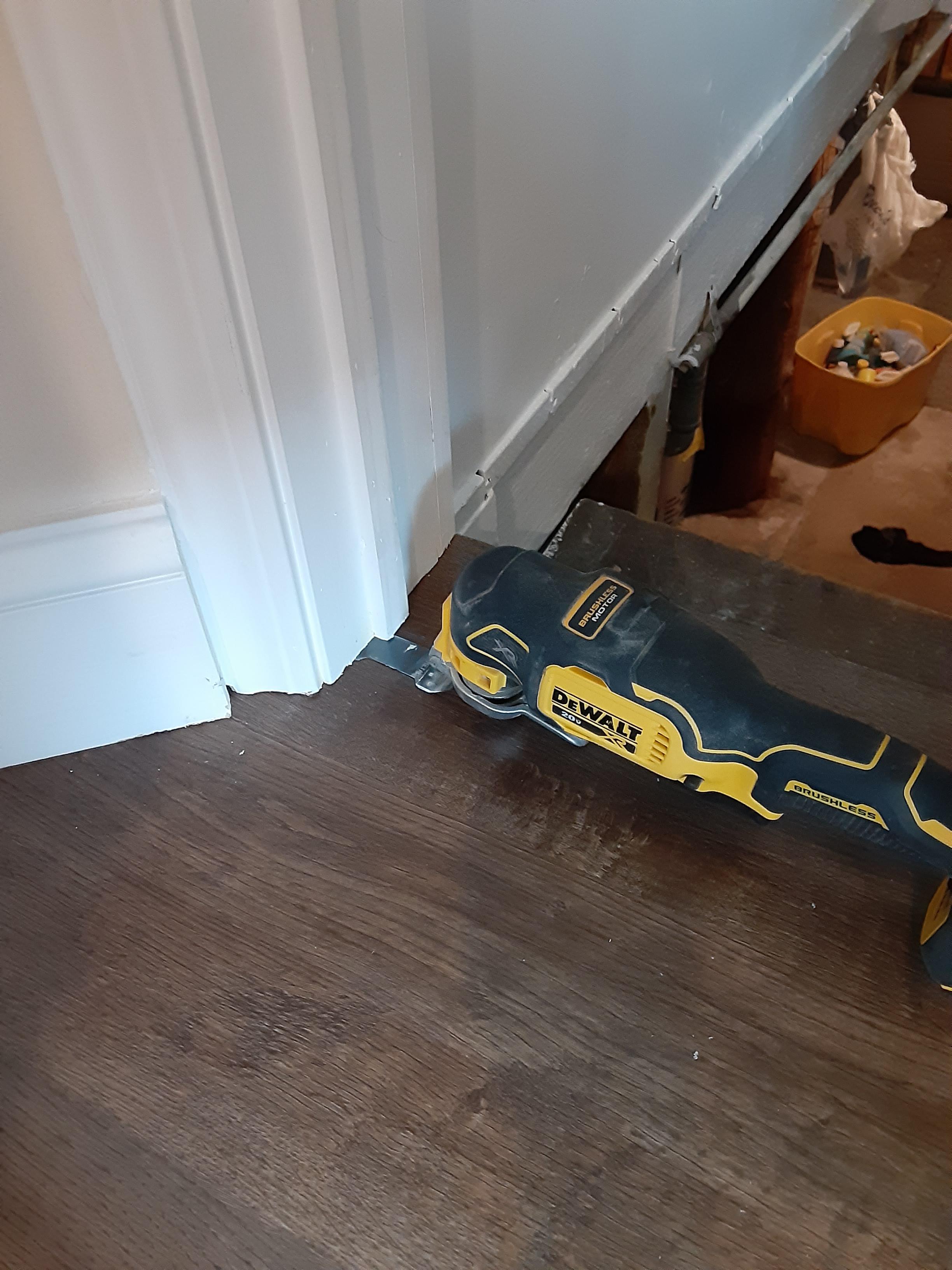 This is a properly undercut door casing and one of the tools to do it Scrolller