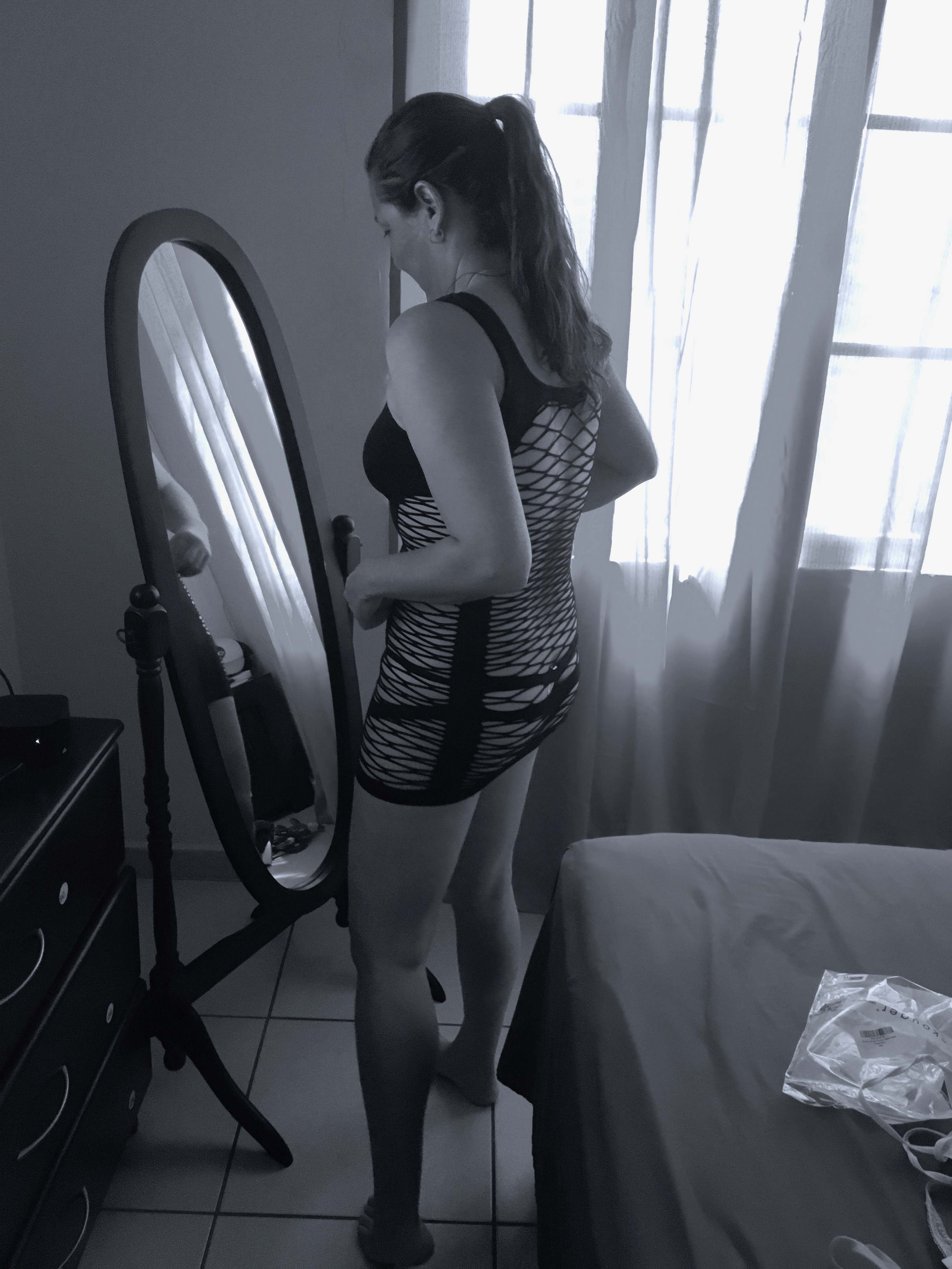 Trying on her new dress