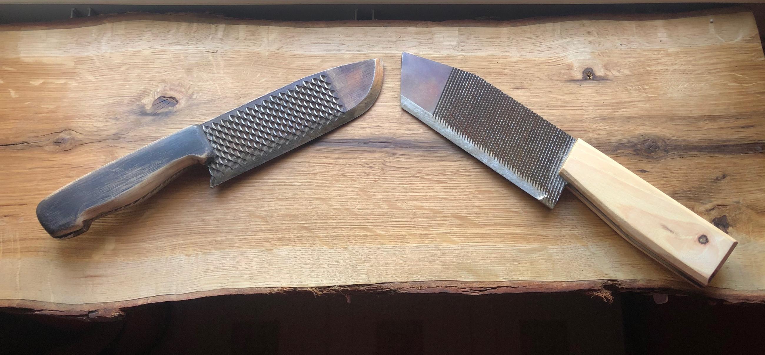 Two knives made out of old horseshoe files. Scrolller