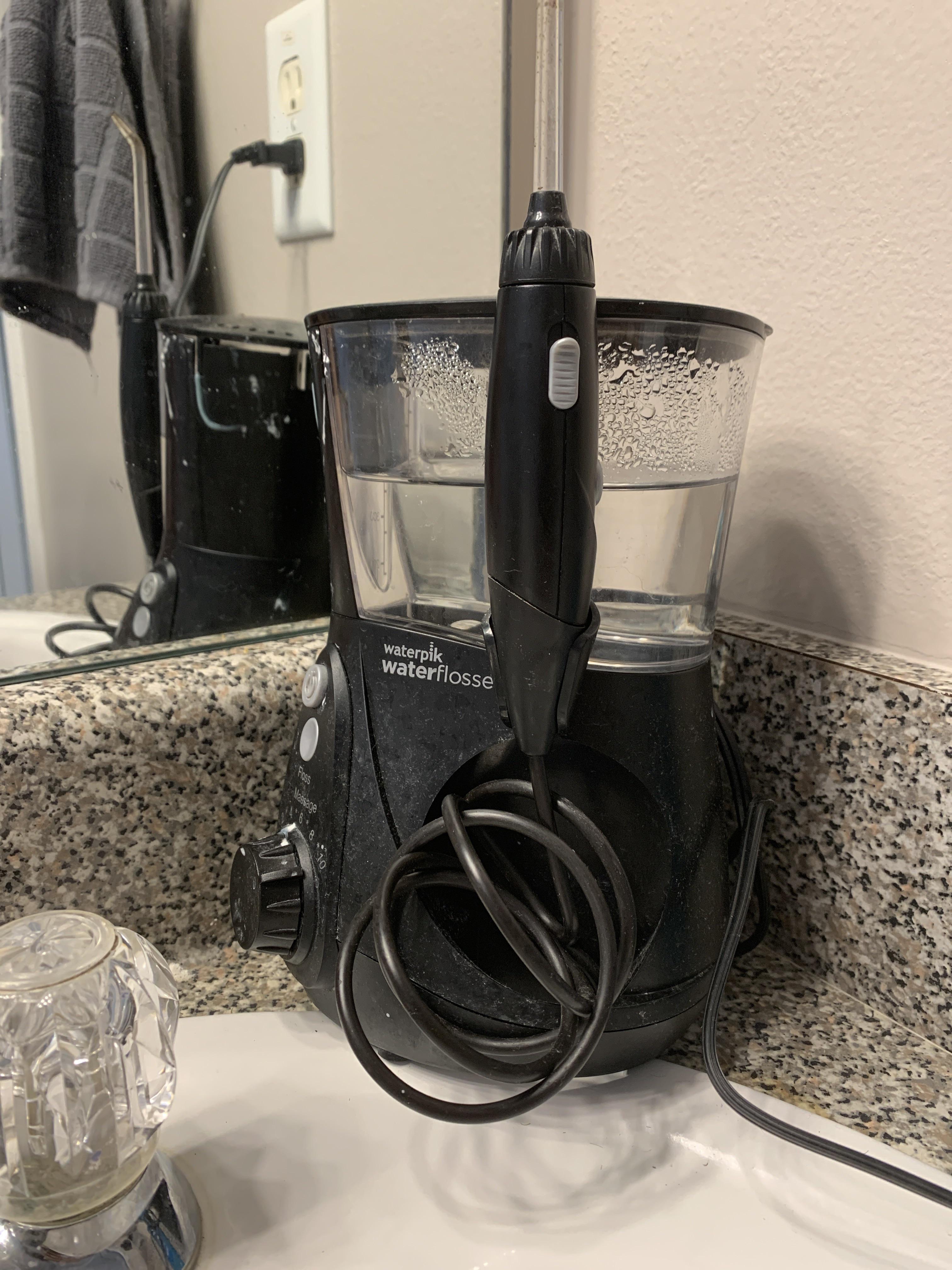 Waterpiks are basically power washers for your glass. Easy to reach