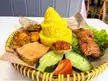 [i ate] Nasi kuning with chicken leg and beef radeng 