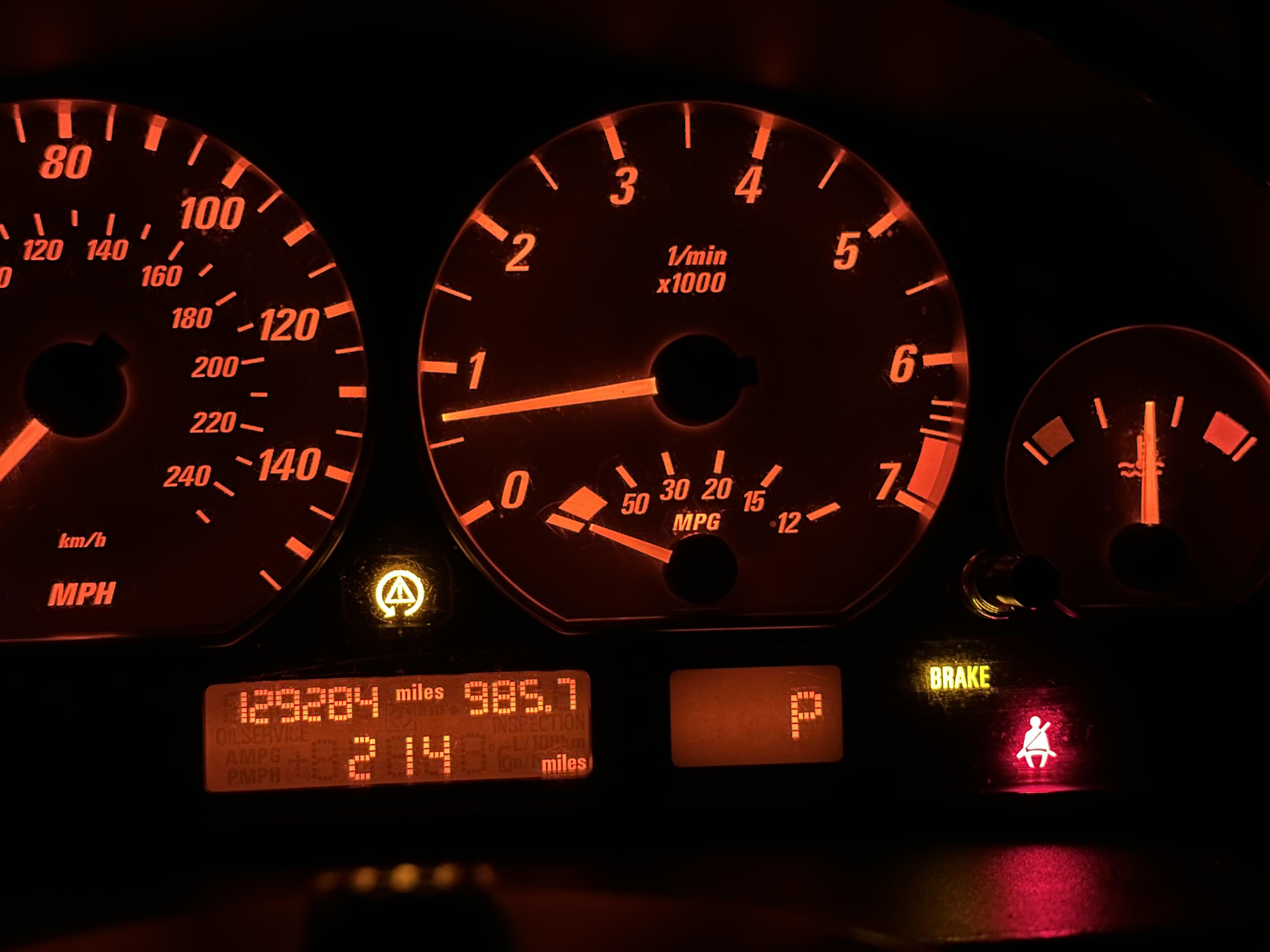 what-does-this-light-mean-hazard-triangle-with-circle-and-brake