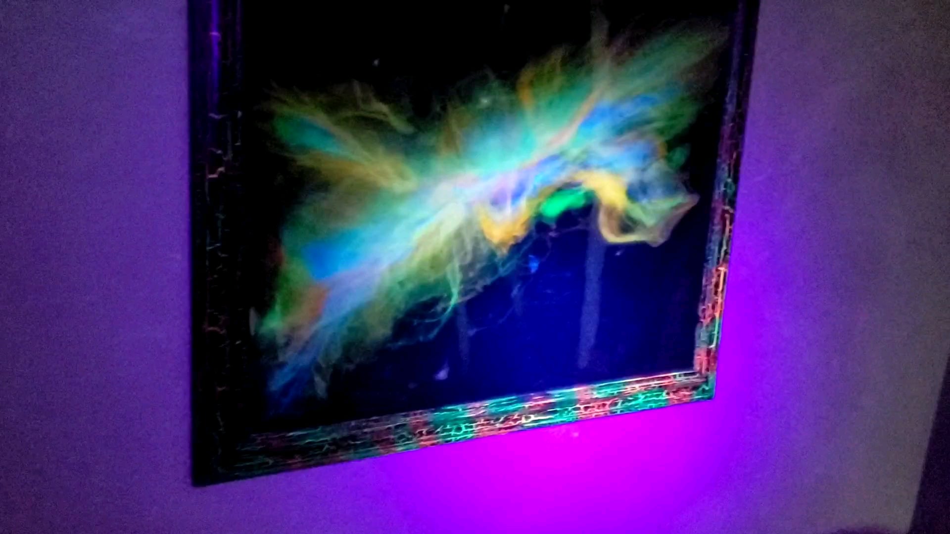 Resin pour with florescent/glow piments. Mounted in a florescent crackle frame.