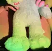 Curvy FTM person naked in a bedroom, using a plush toy to flash their pussy and labia.