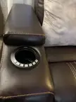 Buttons on new expensive automated couch are facing away from person sitting in chair instead of towards them.