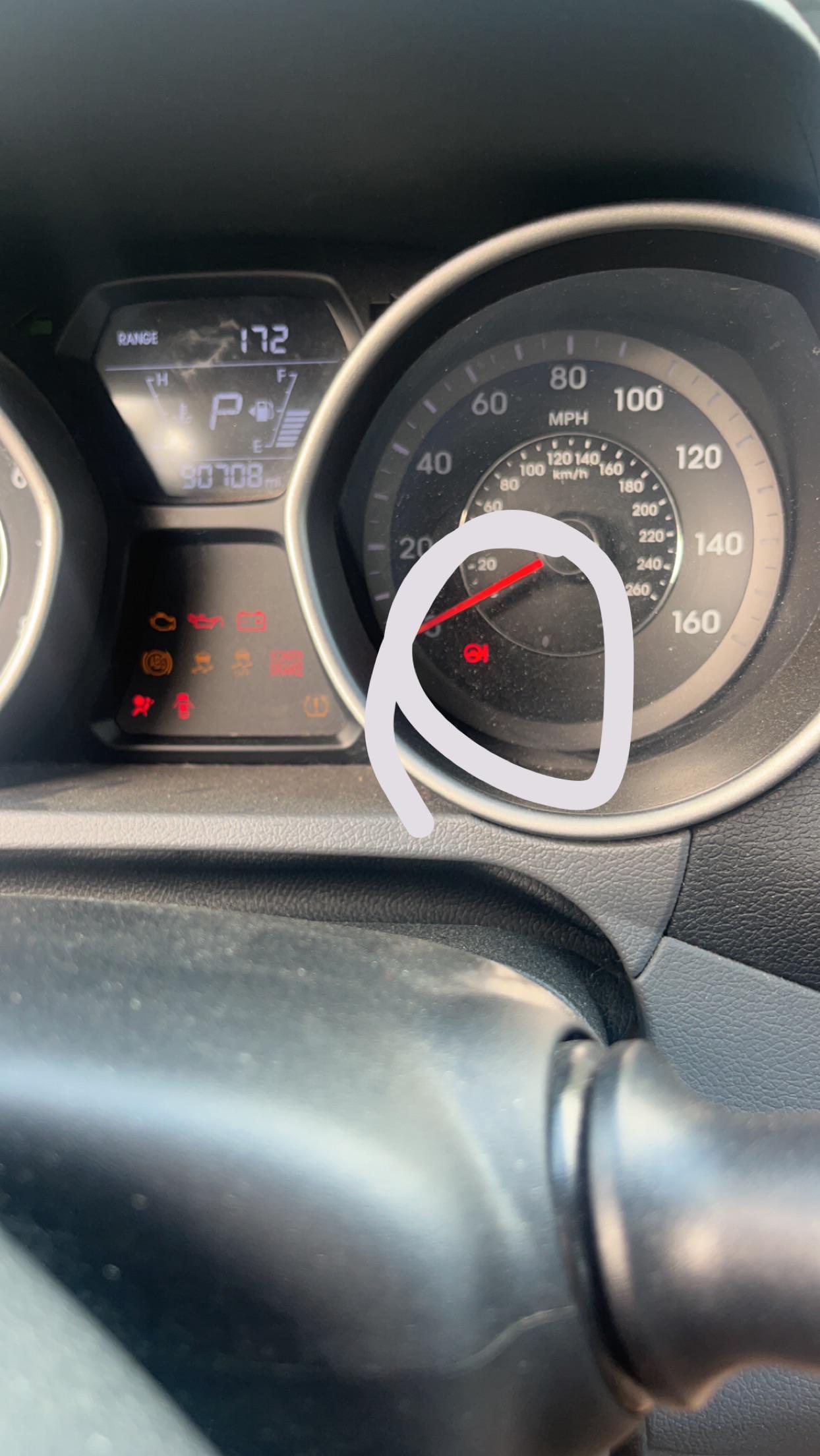 What is this red light on my dash, I have circled ???
