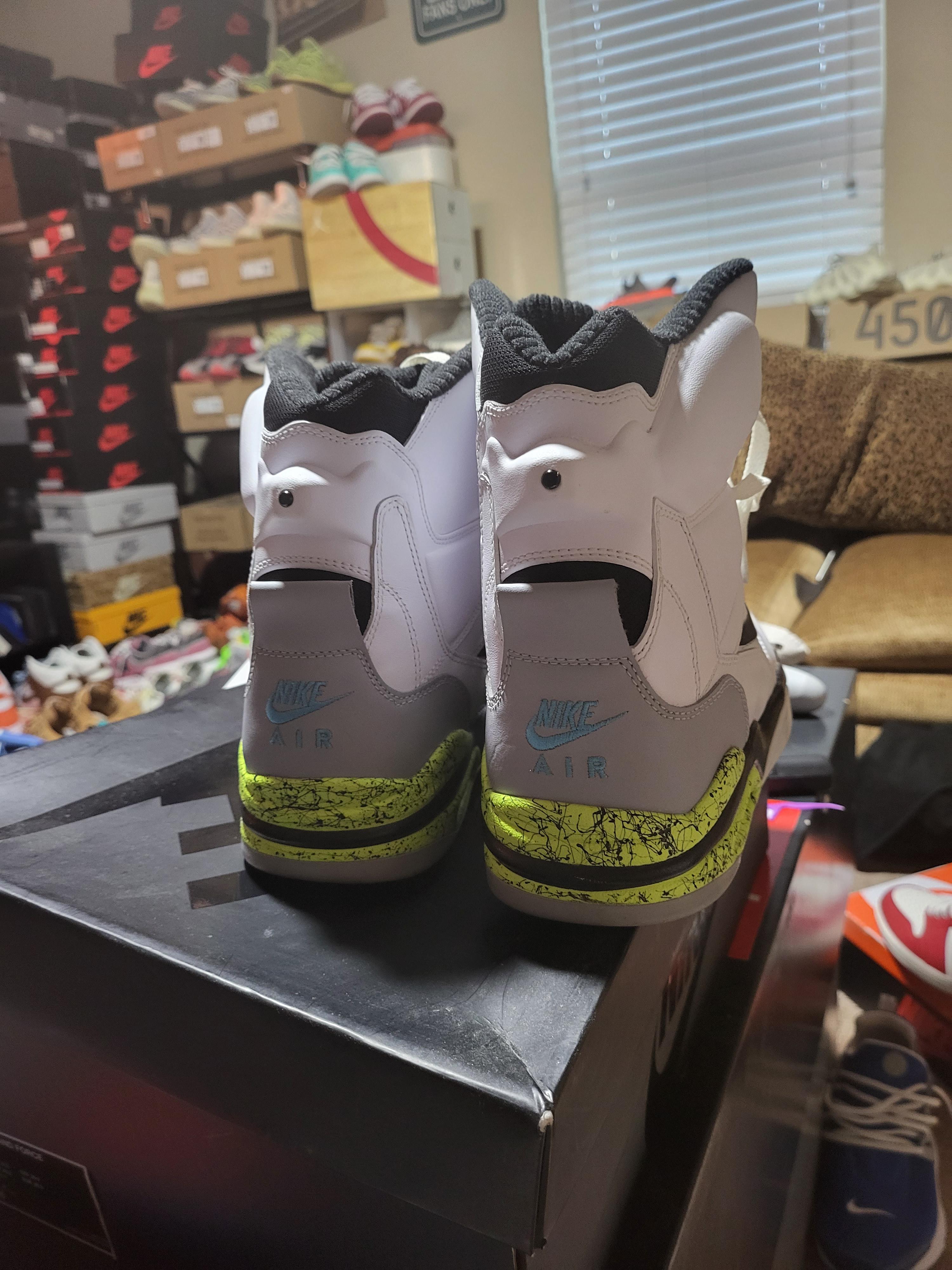 Command Force black and white high-top sneakers sitting on a black shoe box