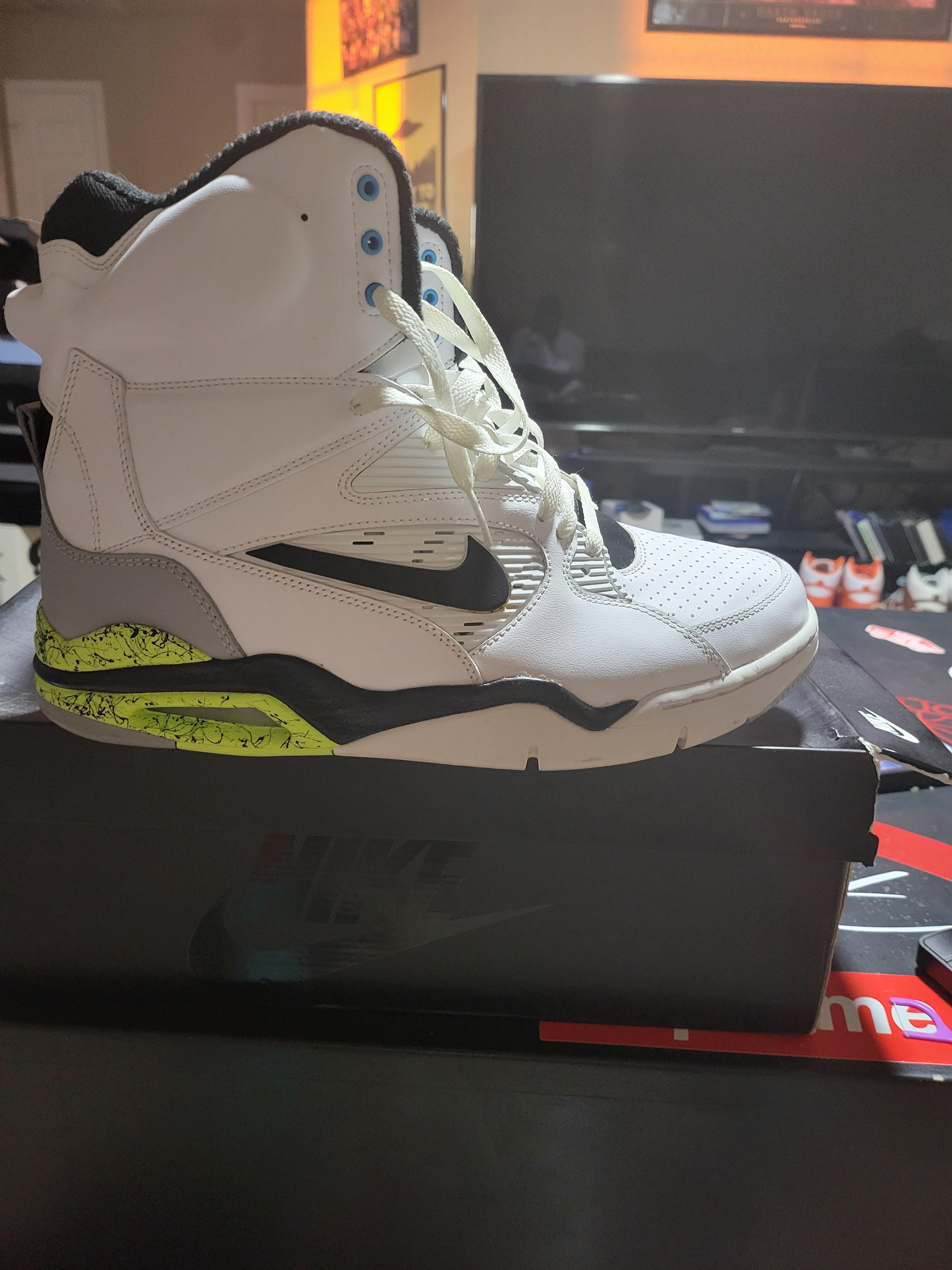 Command Force black and white high-top sneakers sitting on a black shoe box