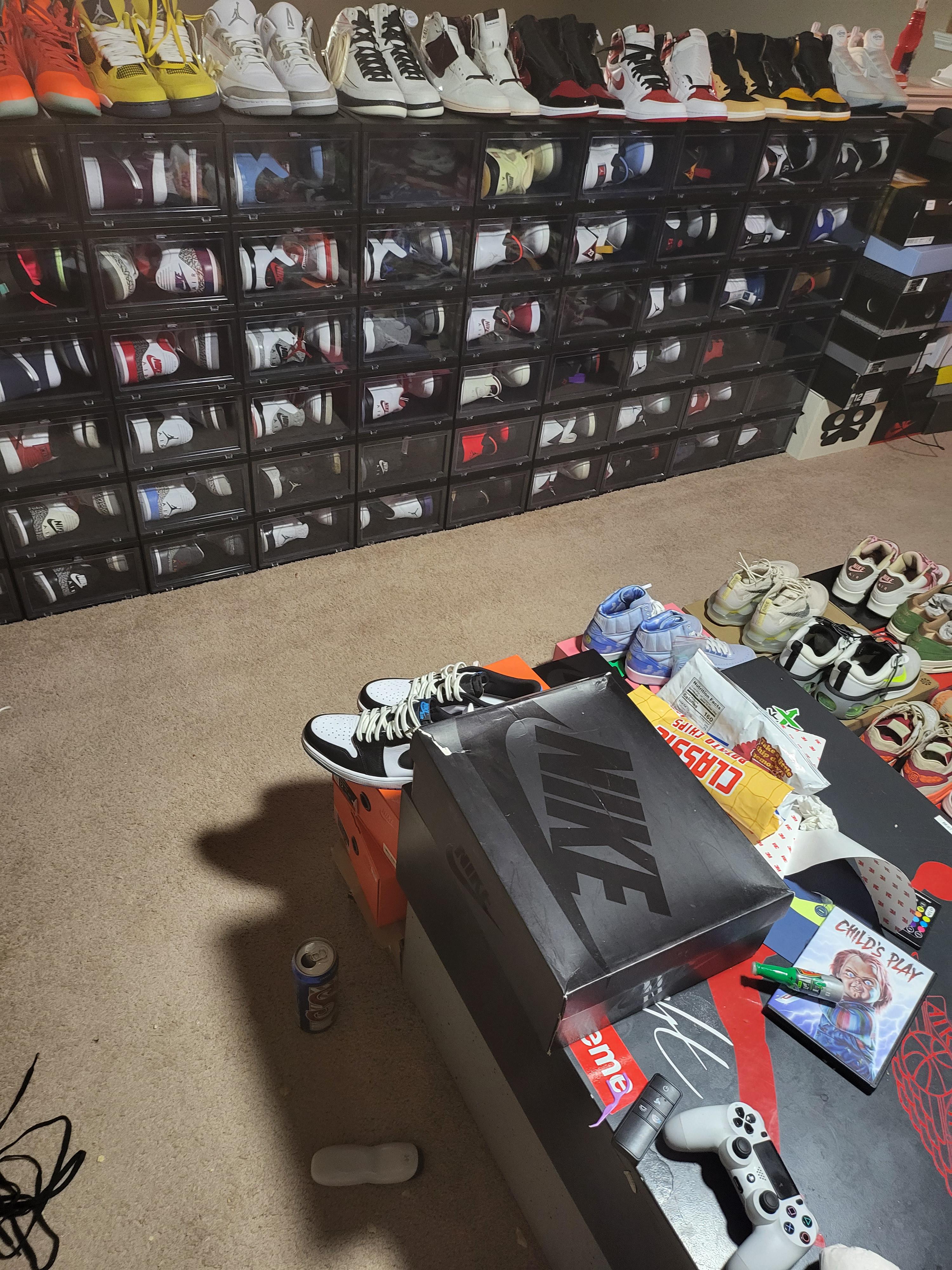 Command Force black and white high-top sneakers sitting on a black shoe box