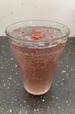Chamomile and hibiscus tonic with red pepper garnish