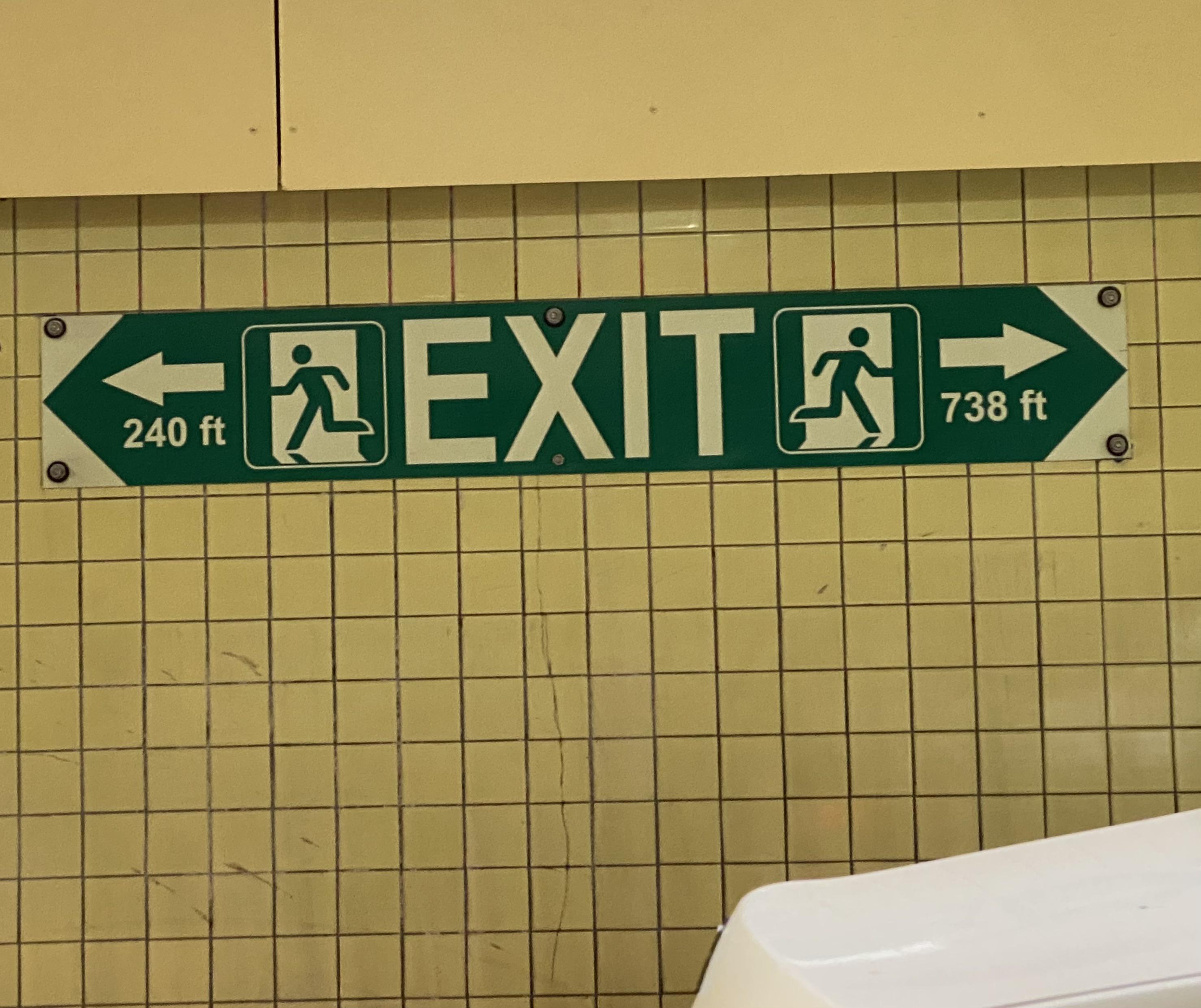 Nearest Exit Emergency exit sign in a tunnel telling you how far to the nearest exit ...