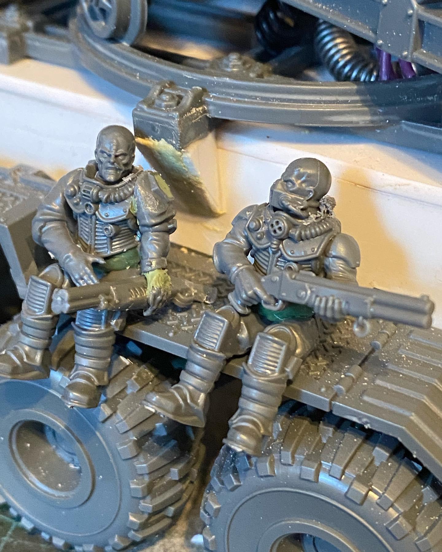 Custom-built Tyrannofex miniature vehicle model and crew on a green cutting mat