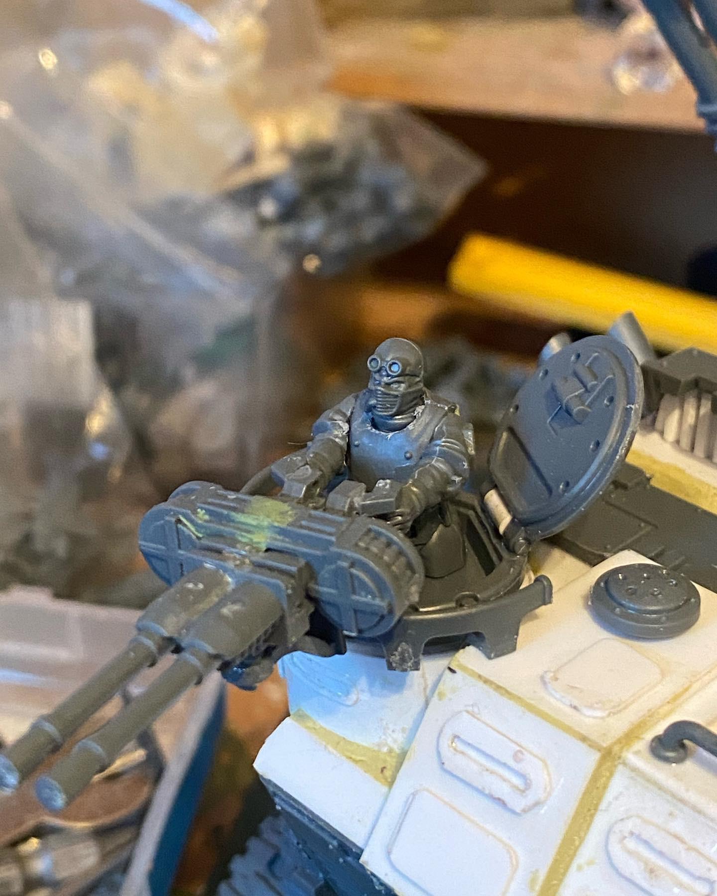 Custom-built Tyrannofex miniature vehicle model and crew on a green cutting mat