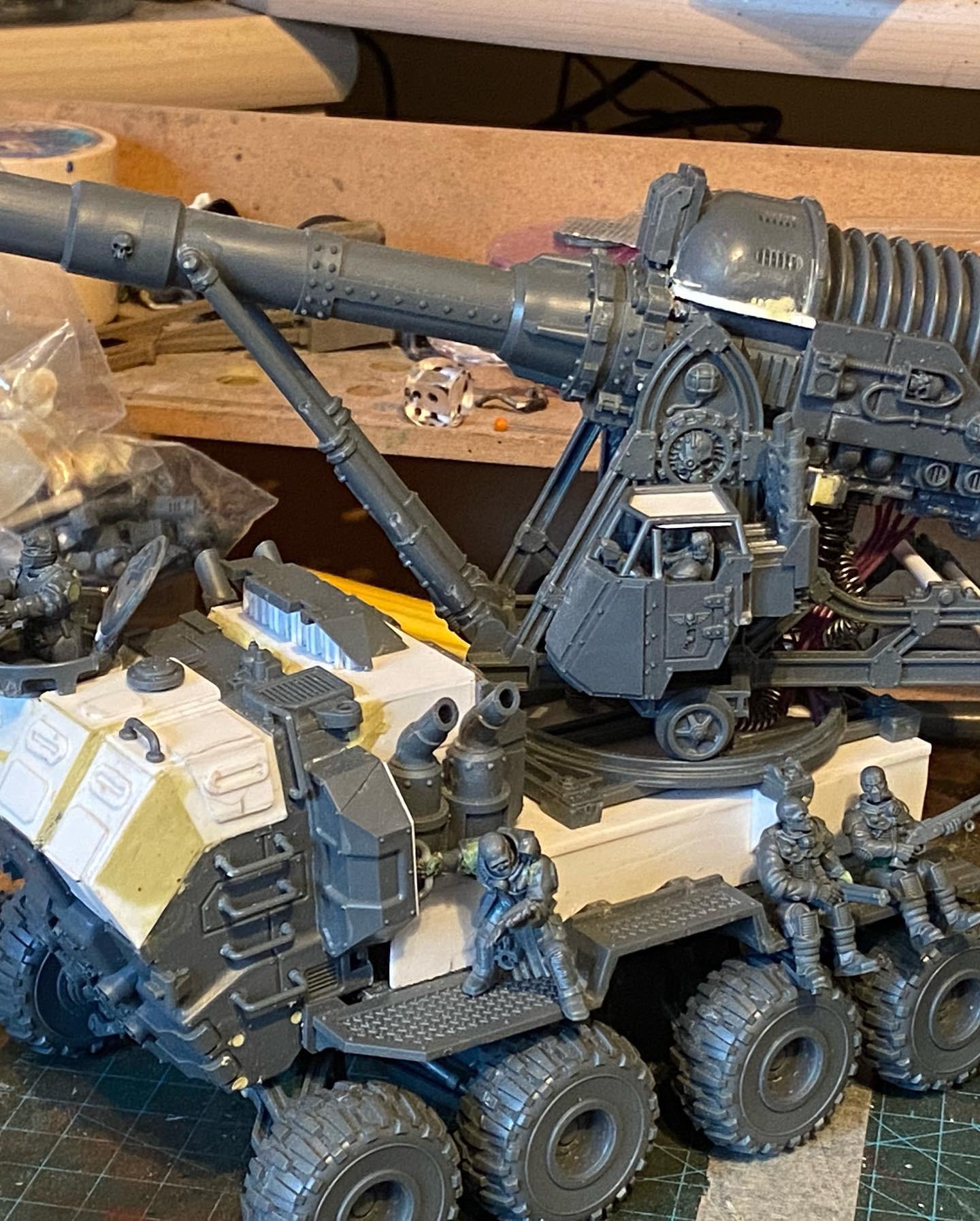 Custom-built Tyrannofex miniature vehicle model and crew on a green cutting mat