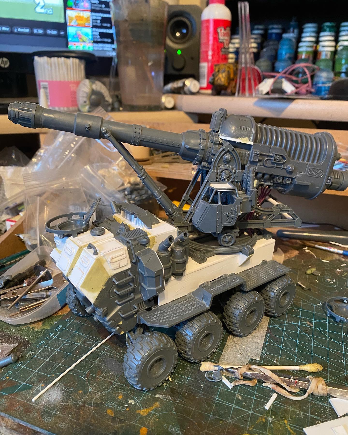 Custom-built Tyrannofex miniature vehicle model and crew on a green cutting mat