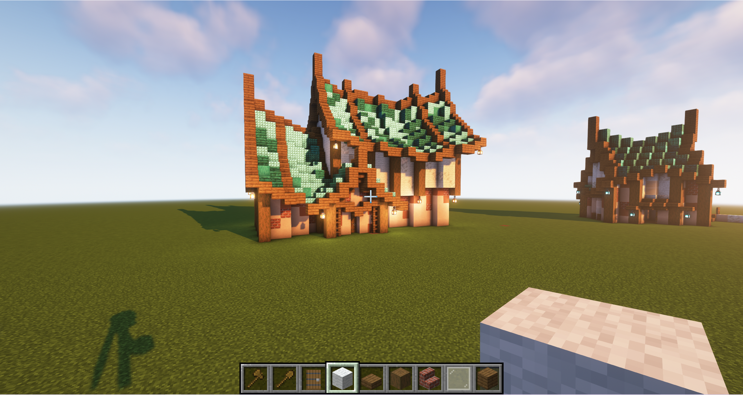 Japanese minecraft builds featuring a traditional East Asian style house with a green roof and wooden walls