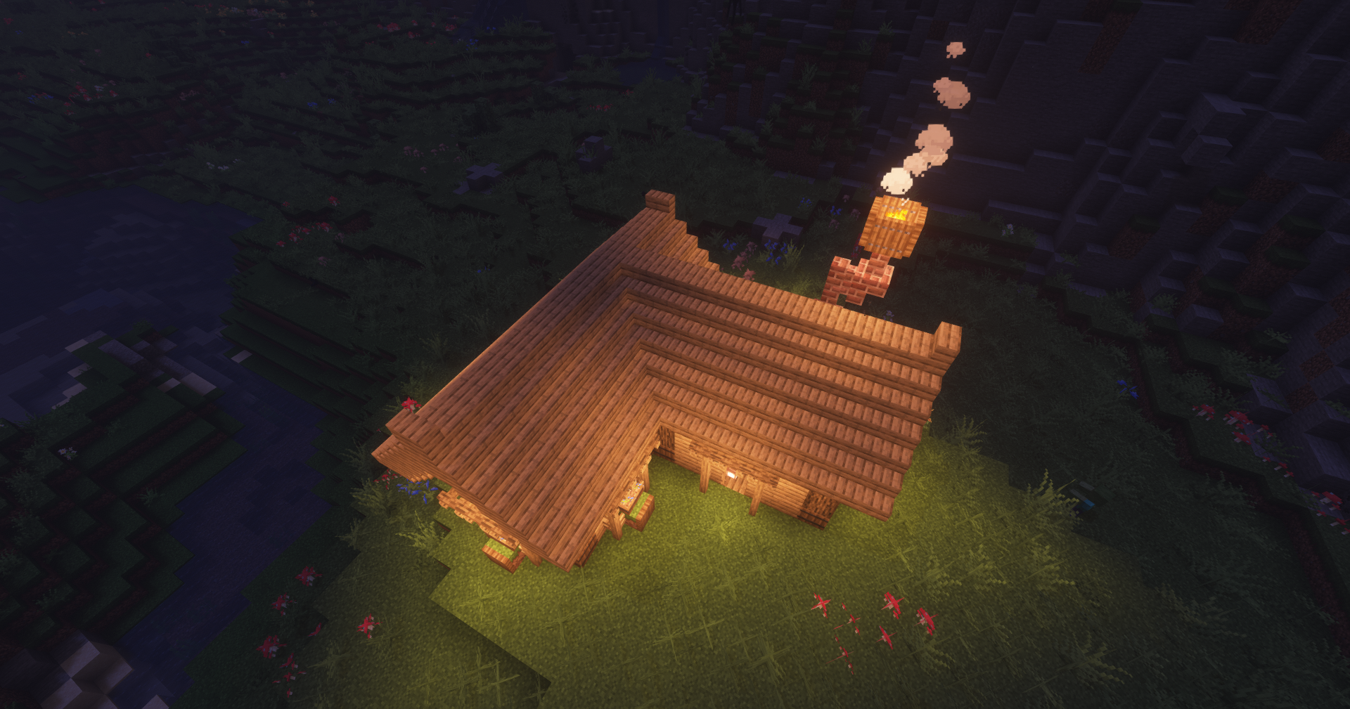 Medium size survival hut in Minecraft with lanterns and interior furniture