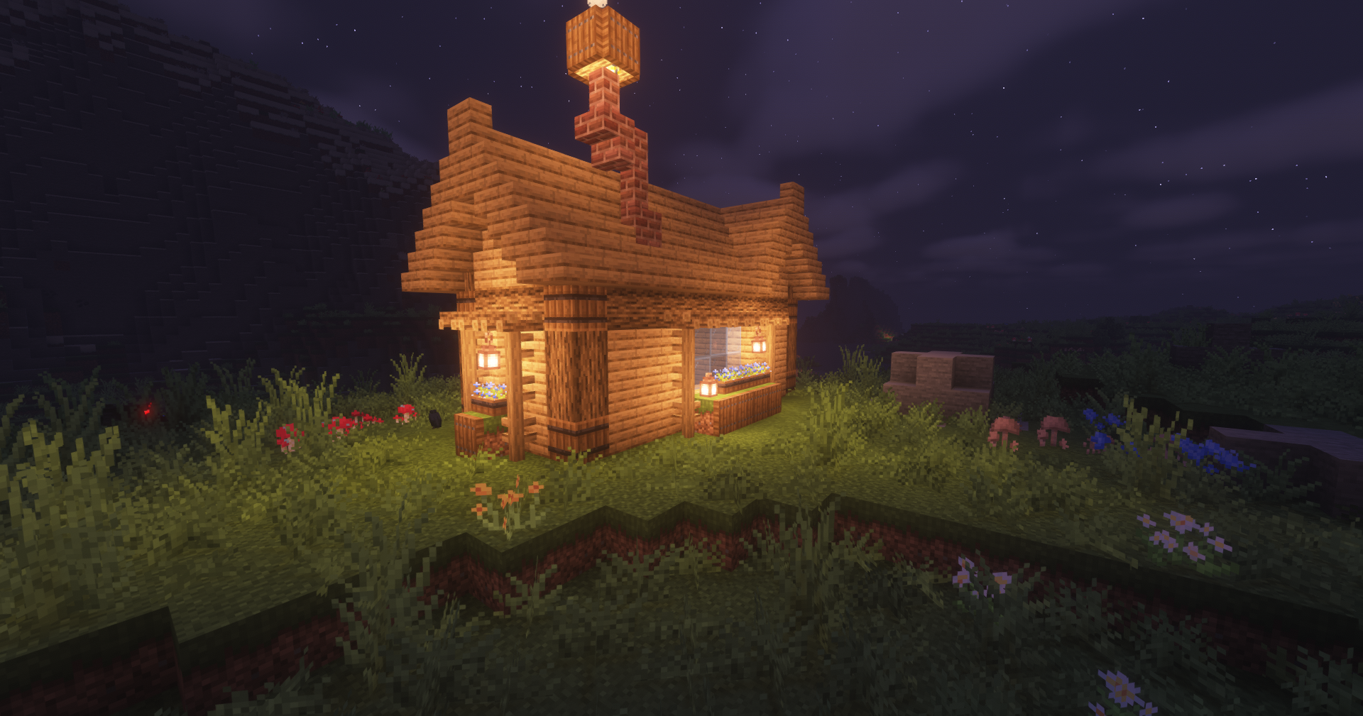 Medium size survival hut in Minecraft with lanterns and interior furniture