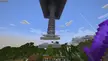Minecraft Endermen farm build featuring a tall stone pillar in a forested mountain landscape